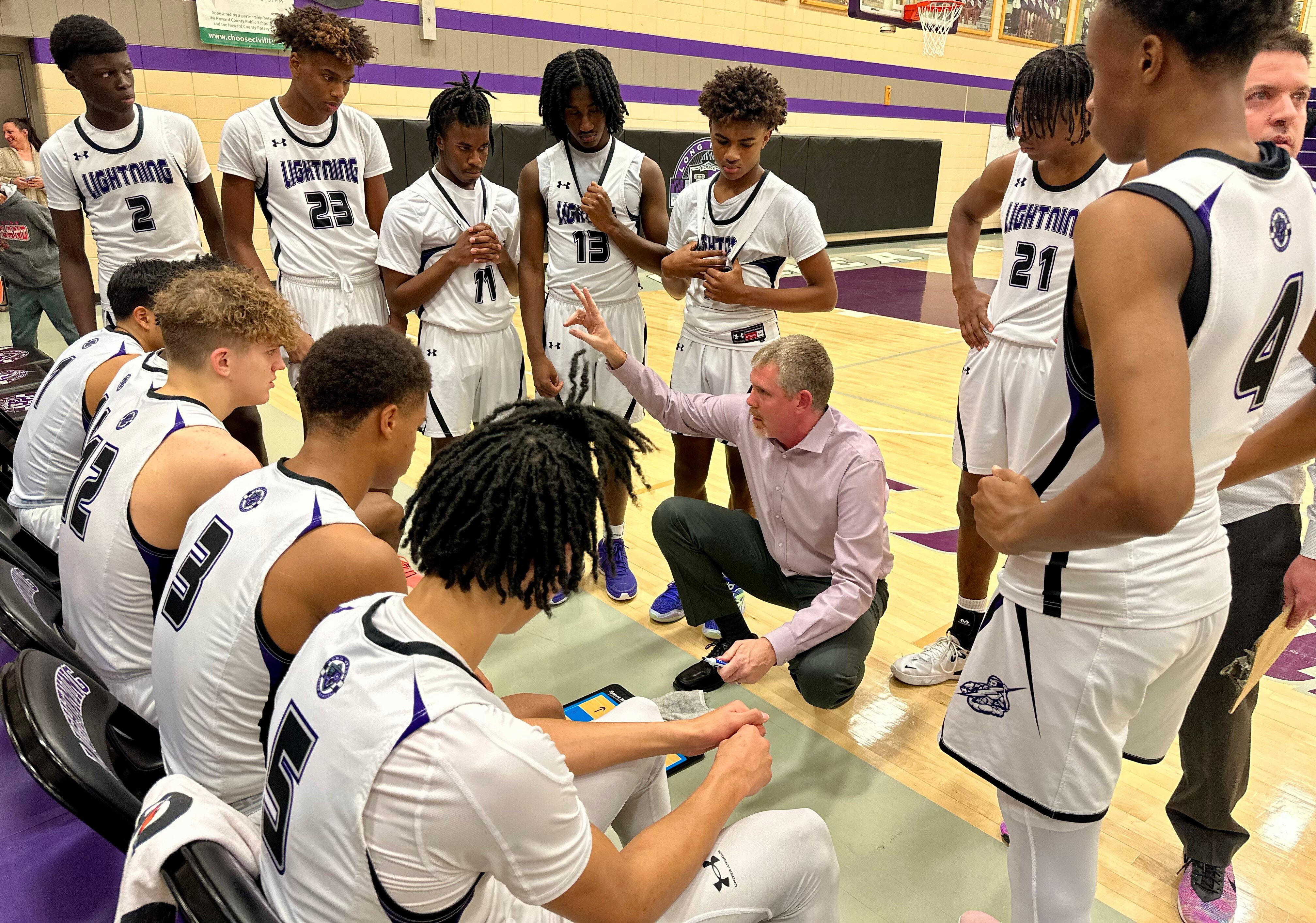 Long Reach boys basketball coach Andrew Lazzor addresses his team during a timeout in Wednesday's 79-41 win over Hammond as the Lightning improved to 4-0 for the first time since 2007-08.