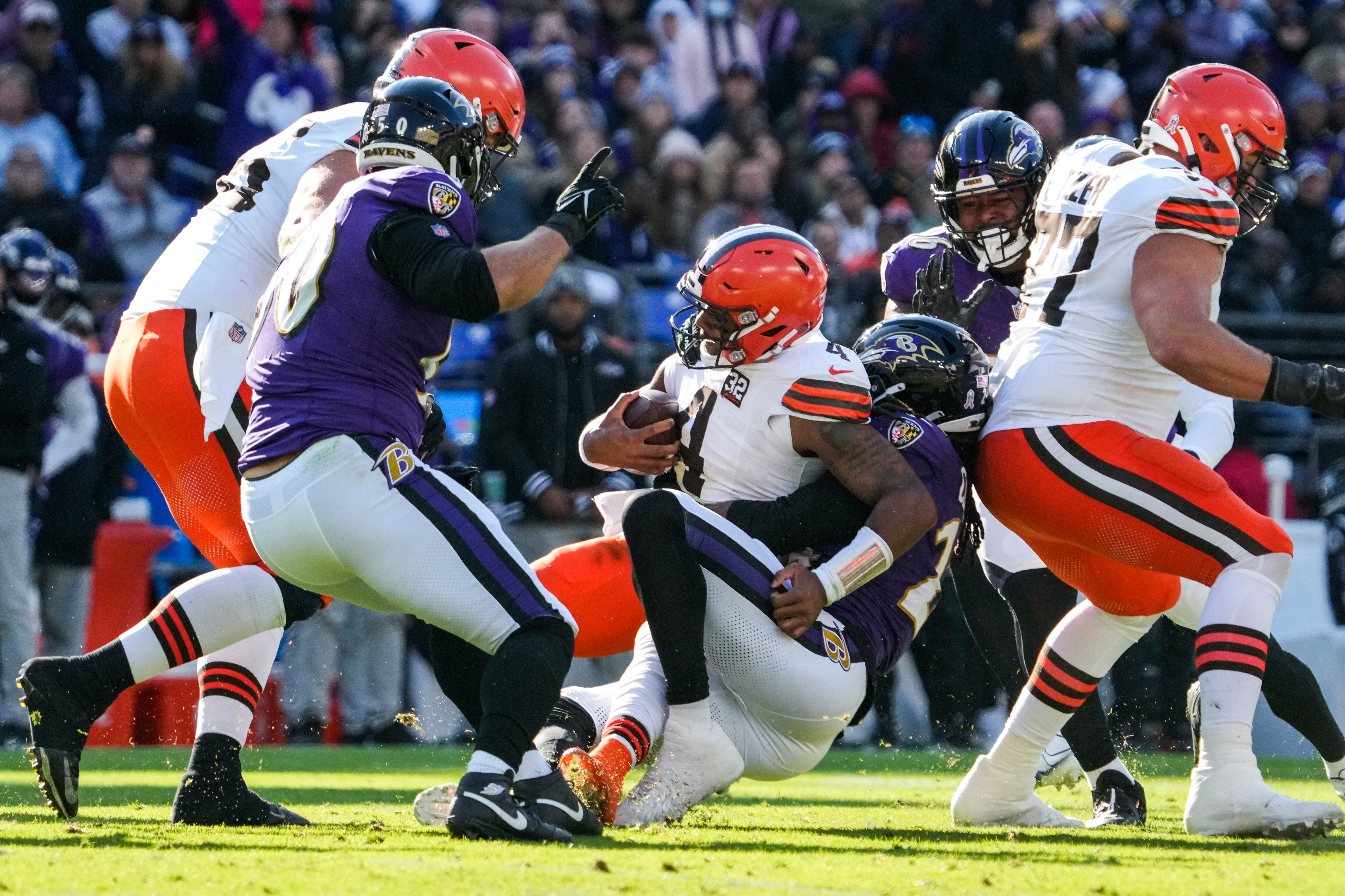 Baltimore Ravens linebacker Jadeveon Clowney (24) sacks Cleveland Browns quarterback Deshaun Watson (4) during the first quarter at M&T Bank Stadium on Sunday, Nov. 12, 2023.