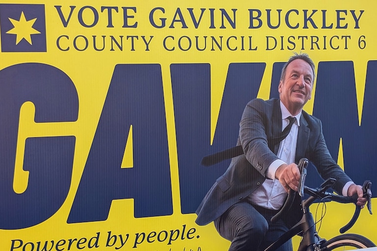 Former mayor Gavin Buckley's new campaign signs for county council feature him on a bike, an image familiar to many after eight years in office.
