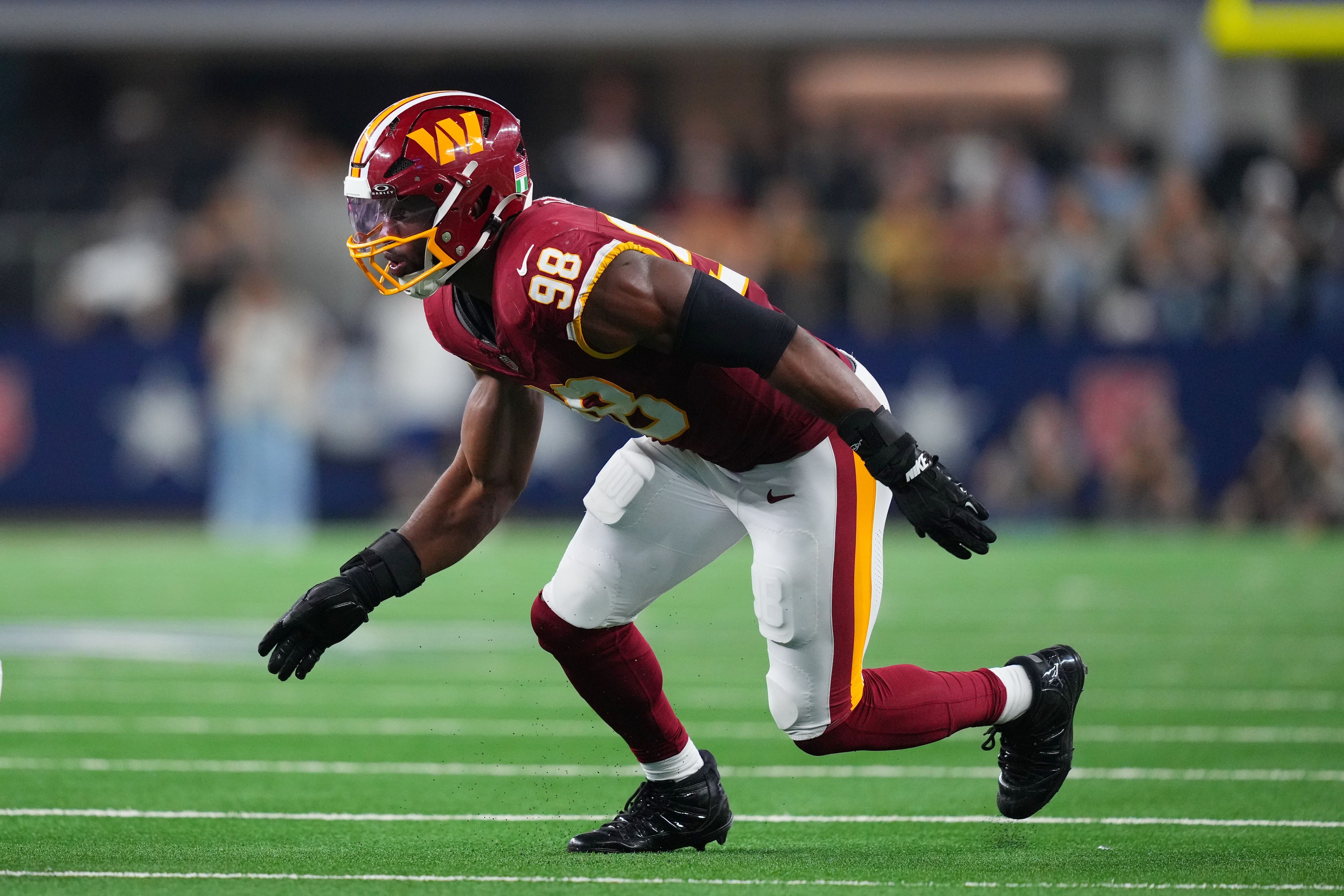 Washington Commanders linebacker Odafe Oweh (98) rushes in during an NFL football game between the Dallas Cowboys and the Washington Commanders in Arlington, Texas, Sunday, Sept. 20, 2026. (AP Photo/Julio Cortez)