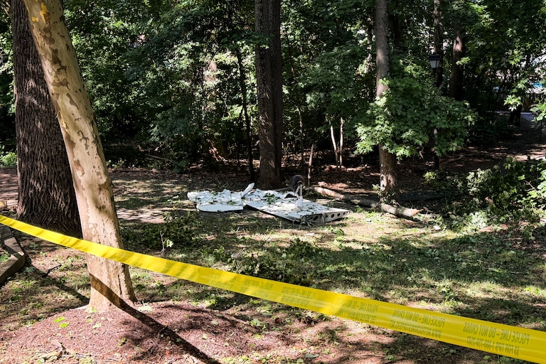SUNDAY, JUNE 21, 2026 - A portion of the wreckage can be seen at the site where a plane crashed in the woods near a residential area and playground off of Scarlett Oak Court in Bowie on Saturday night.
