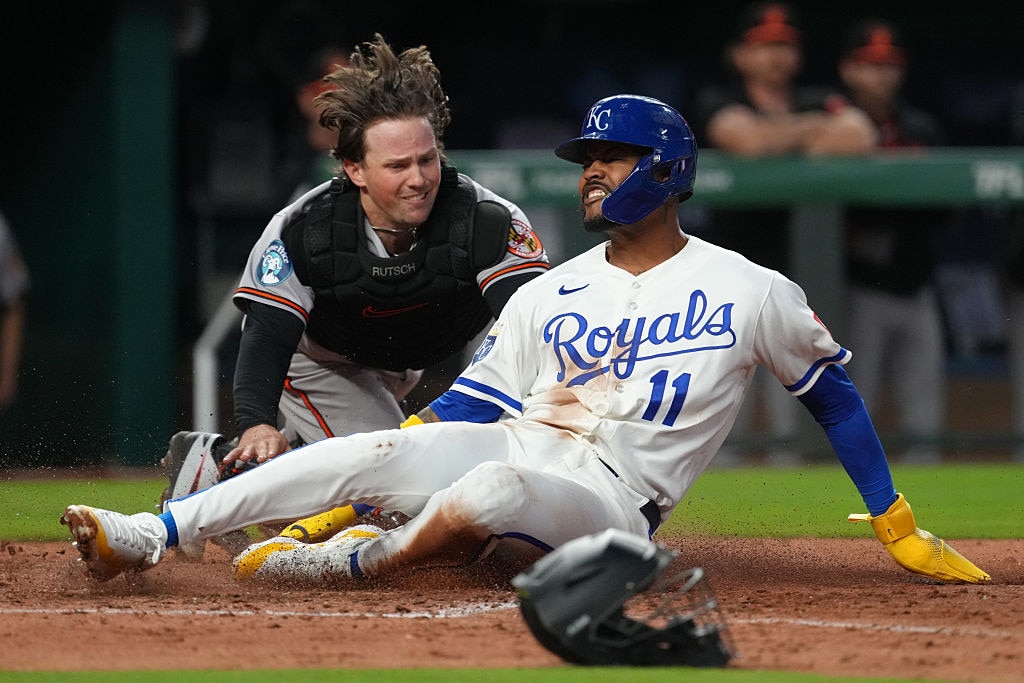 Kansas City Royals third baseman Maikel Garcia scores in the fifth inning before Orioles catcher Adley Rutscman can apply the tag.