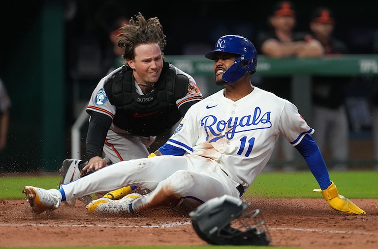 Kansas City Royals third baseman Maikel Garcia scores in the fifth inning before Orioles catcher Adley Rutscman can apply the tag.