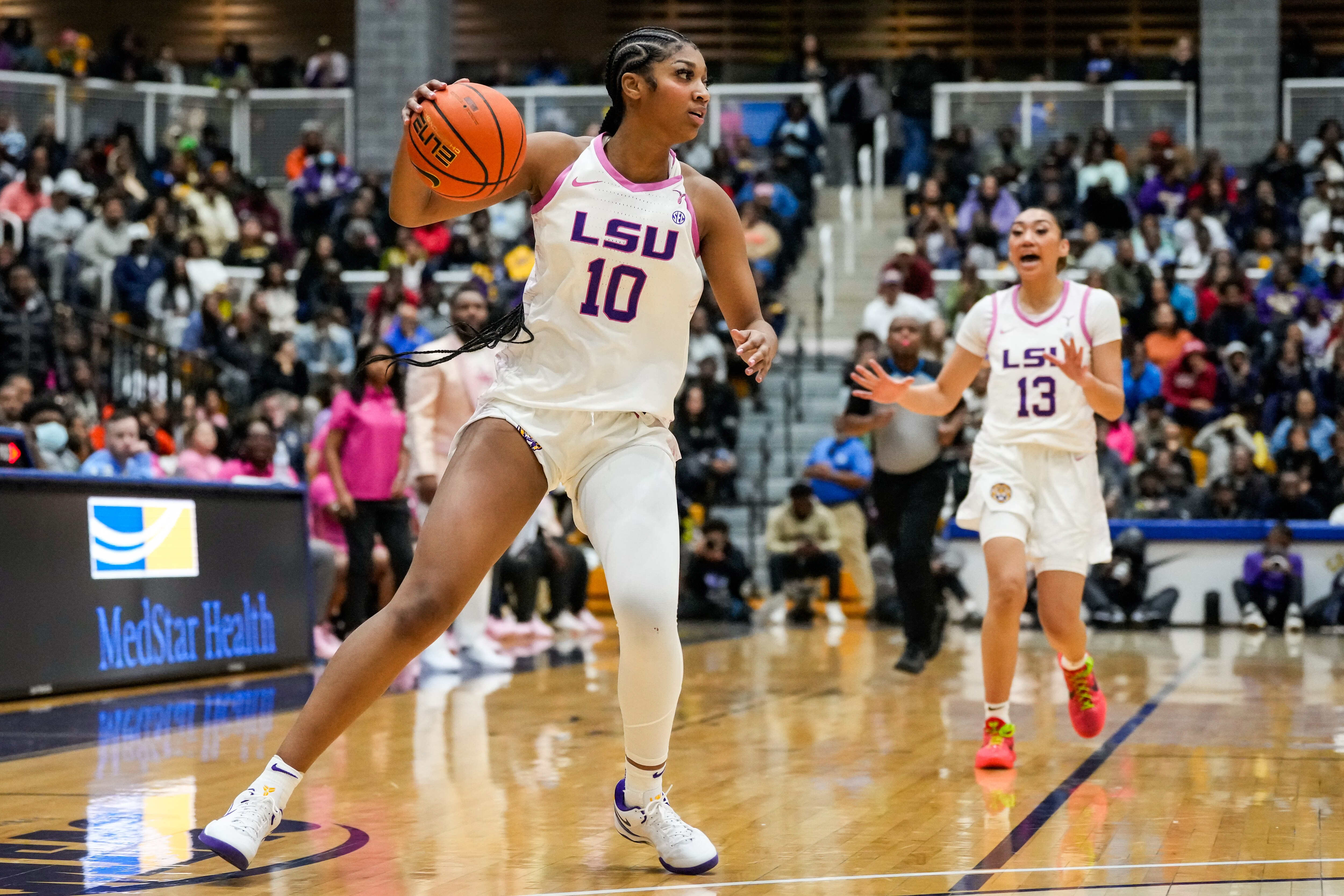 LSU Tigers forward and Baltimore native Angel Reese (10) dribbles down the court during the third quarter against the Coppin State Eagles in Baltimore, Md. on Wednesday, Dec. 20, 2023.