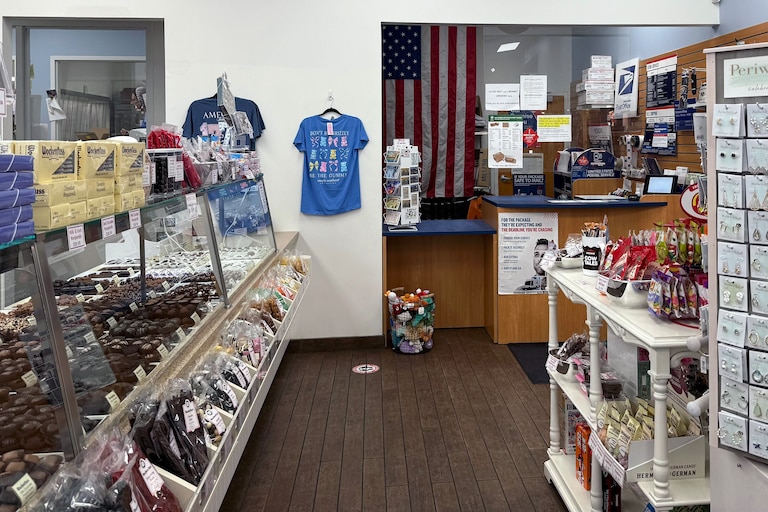 June 11, 2026 - The majority of customers to Wockenfuss Candies on Harford Road come in to mail something and then buy chocolate on their way out. Co-owner Jennifer Wockenfuss Waters is concerned about the impact the closure of the post office will have on business.