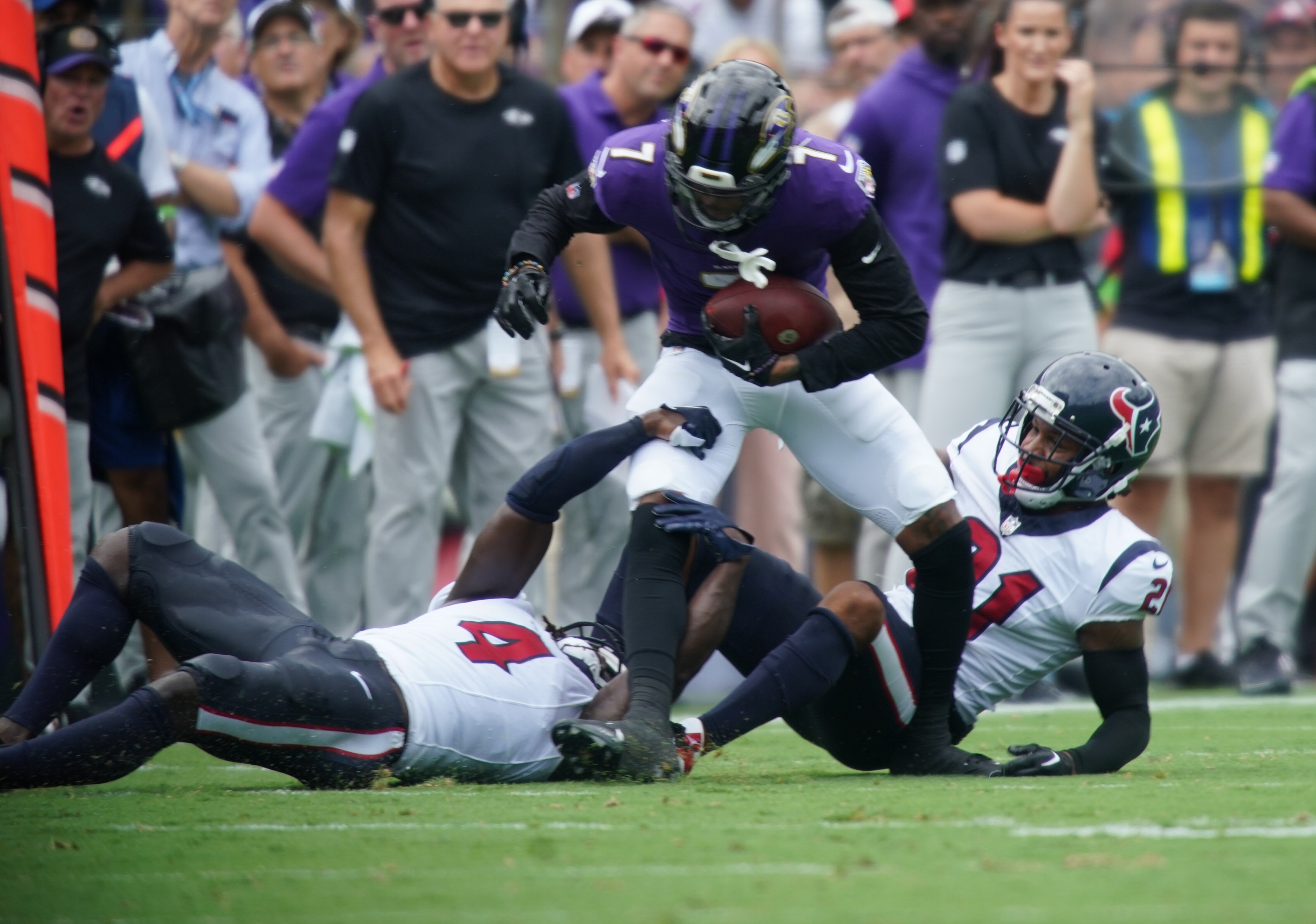 Baltimore Ravens wide receiver Rashod Bateman (7) steps out of the grasp of Texans #4 Tavierre Thomas in the season opening game at M&T Stadium.