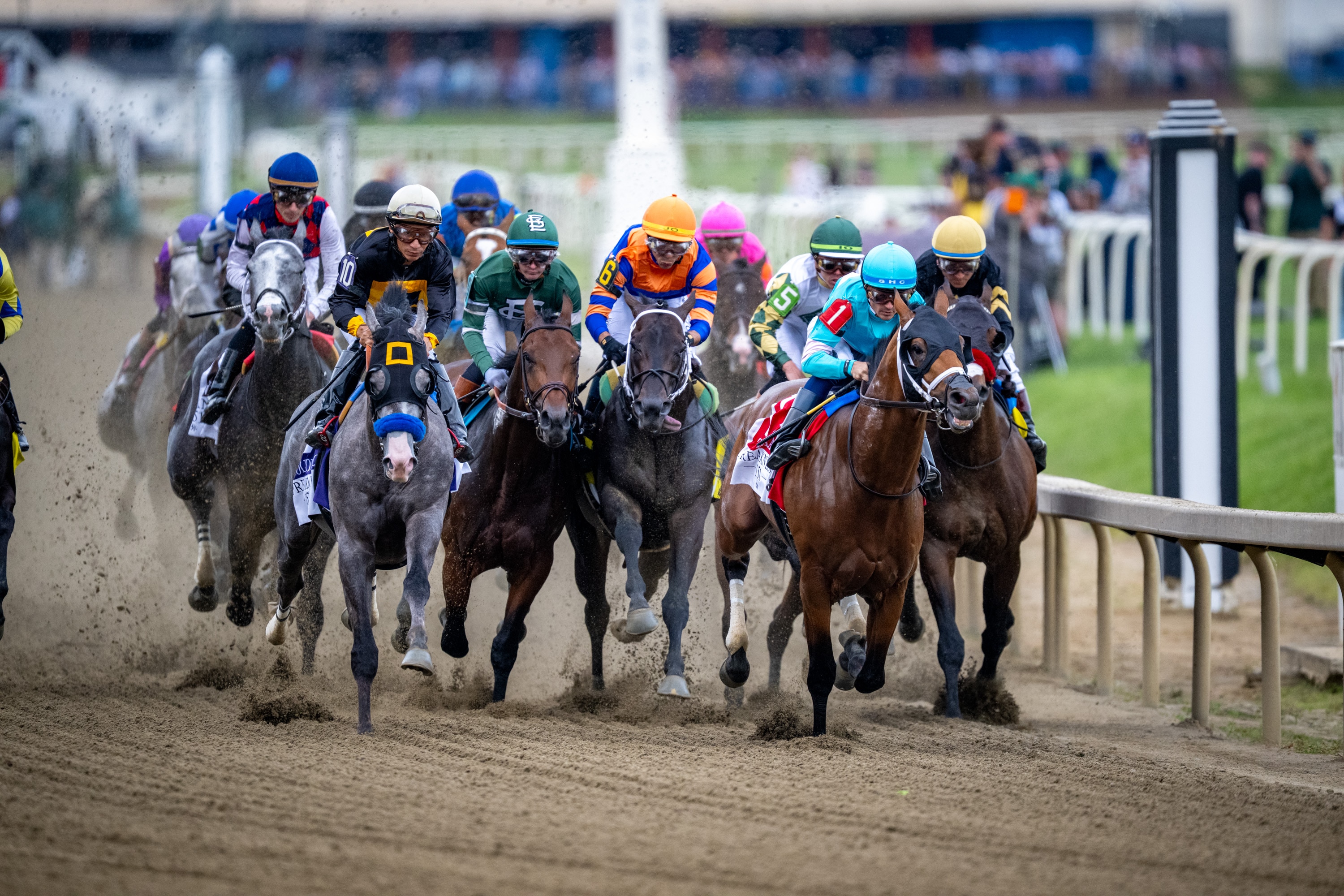 Jockey Sheldon Russell rides Taj Mahal (1) to an early lead out of the gate during the 151st Preakness Stakes at Laurel Park.
