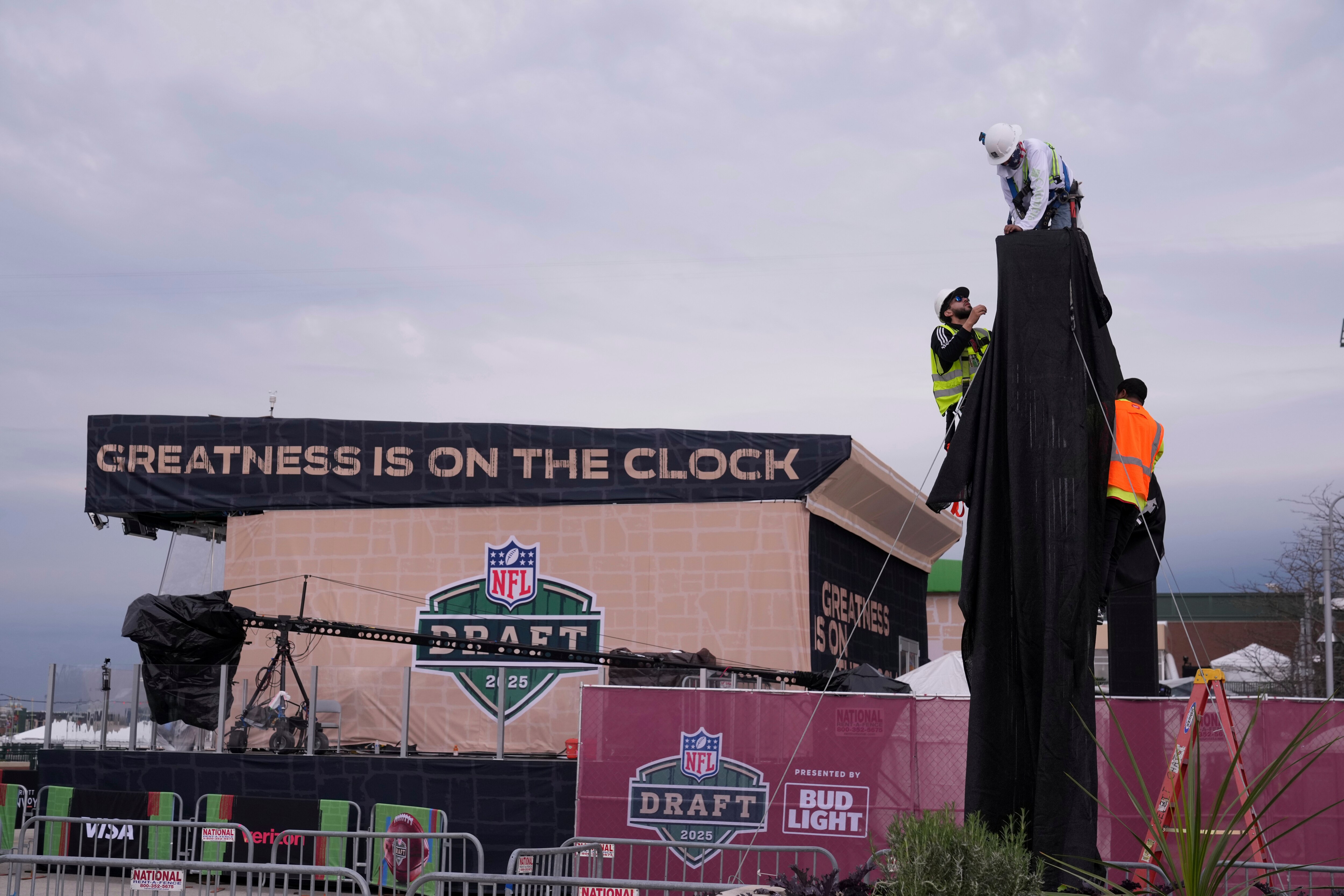 Workers prepare the venue ahead of the NFL football draft Wednesday, April 23, 2025, in Green Bay, Wis.