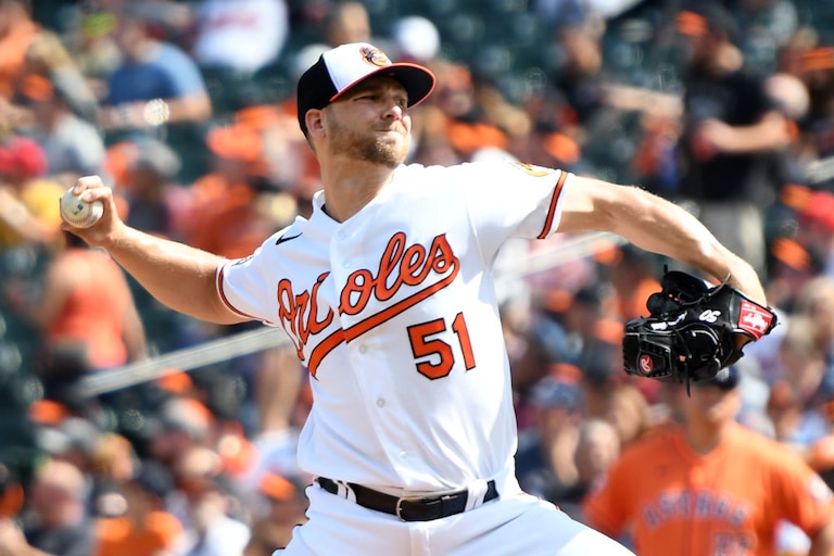 BALTIMORE, MD - SEPTEMBER 25: Austin Voth #51 of the Baltimore Orioles pitches in the first inning during a baseball game against the Houston Astros at Oriole Park at Camden Yards on September 25, 2022 in Baltimore, Maryland.
