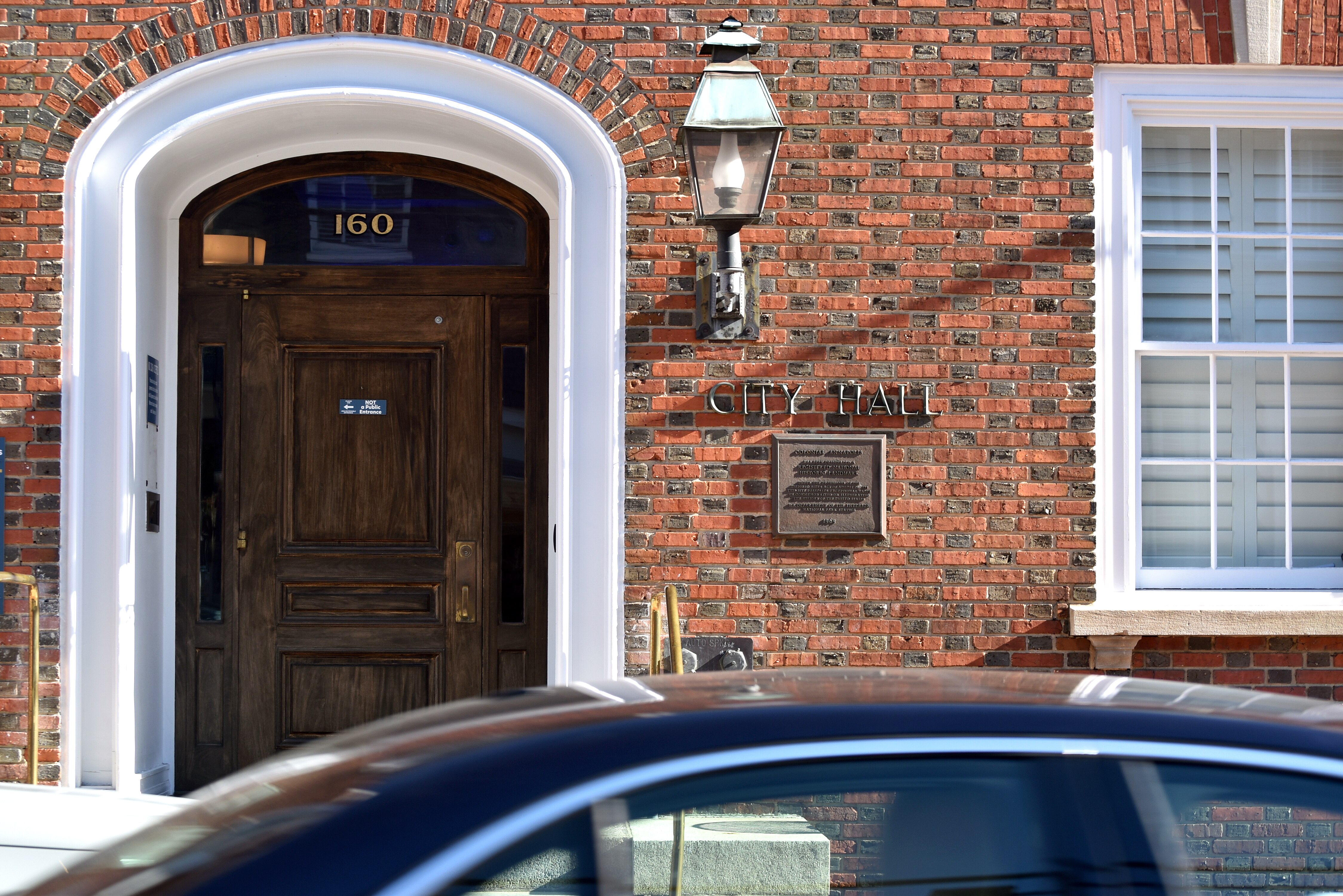 A car drives by Annapolis City Hall at 160 Duke of Gloucester Street on Oct. 22, 2025.