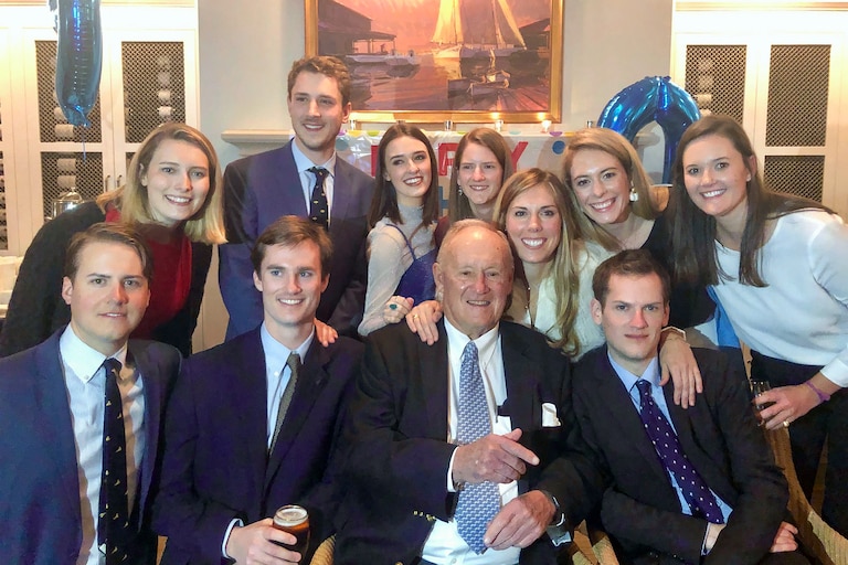 Bill Passano surrounded by his ten grandchildren.