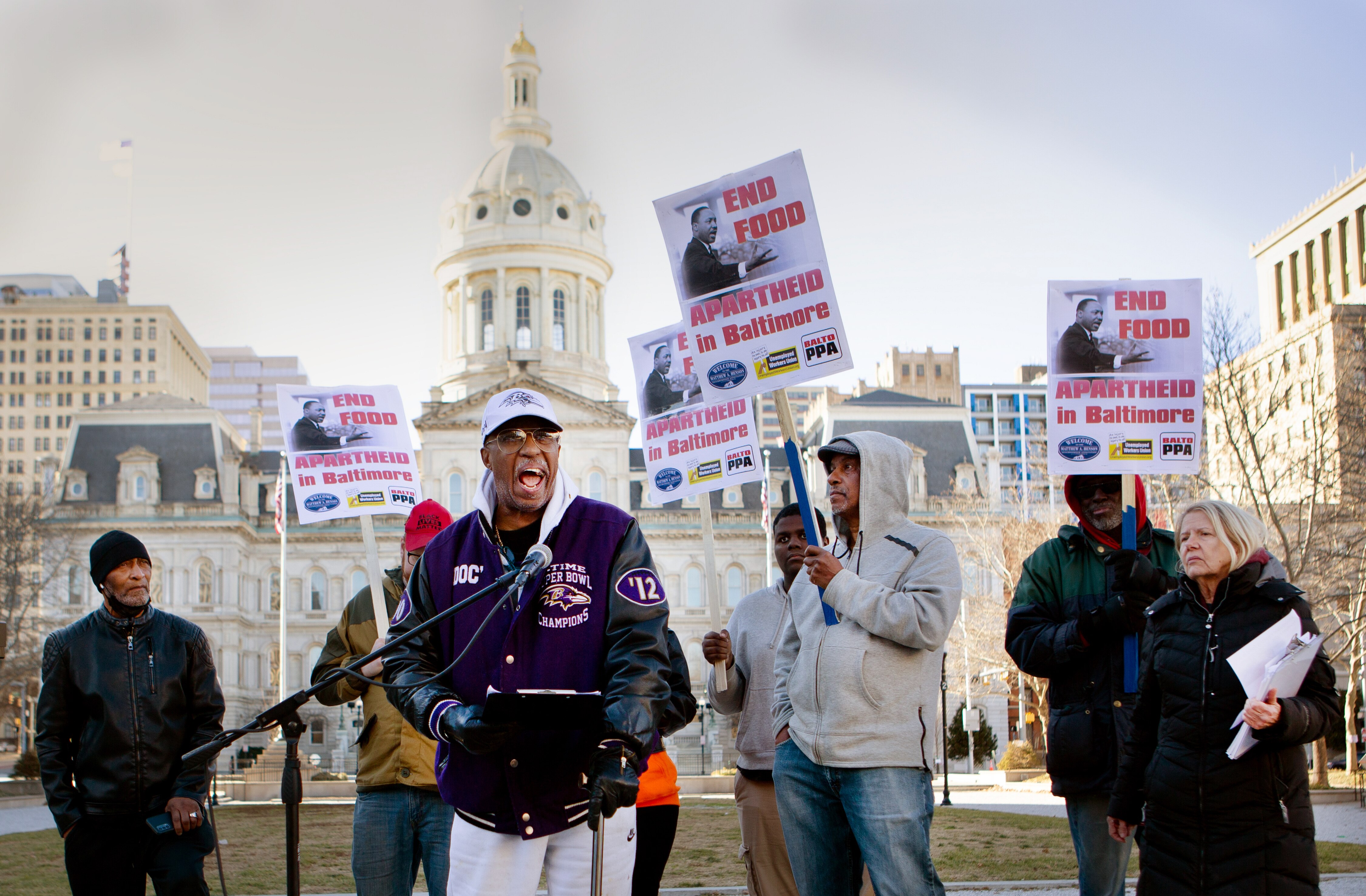 Marvin "Doc" Cheatham of the Matthew A. Henson Neighborhood Association speaks out against food deserts at a rally outside City Hall on Monday, January 16th. A group of organizers from the Peoples Power Assembly, the Matthew A. Henson Neighborhood Association, and the Unemployed Workers Union held the rally to draw awareness to the increasing number of food deserts in Baltimore City.