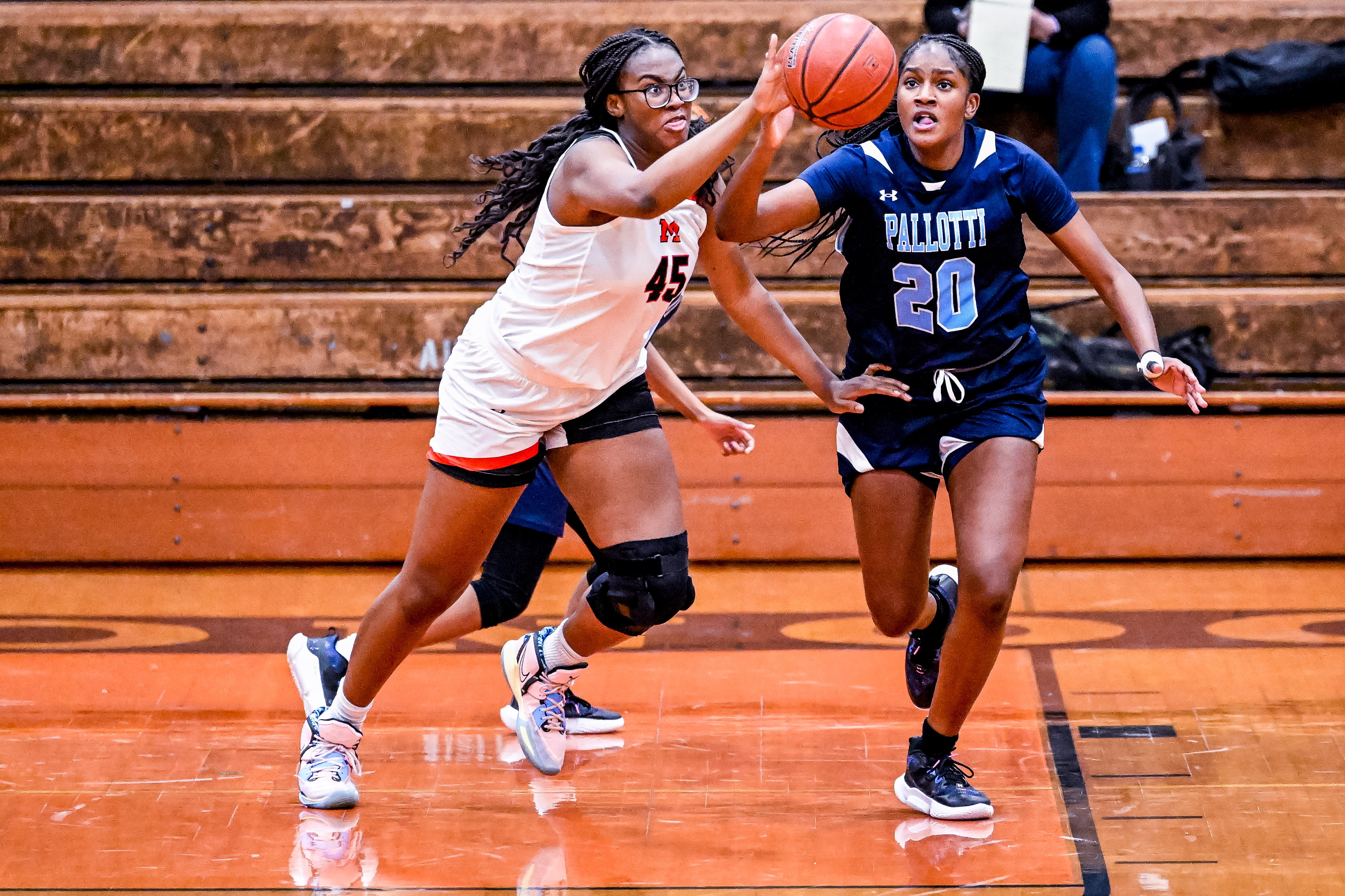 December 10, 2022: McDonogh center Kennedy Umeh (45) and Pallotti forward Savannah Whitley (20) fight for a loose ball during the girlsÕ high school basketball matchup between St. Vincent Pallotti and McDonogh in Owings Mills, Maryland.