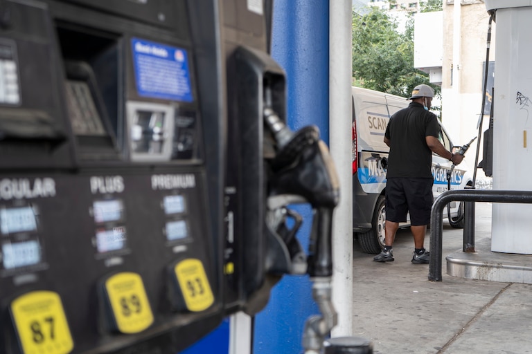 A person pumps gas at a Marathon gas station on North Charles Street.