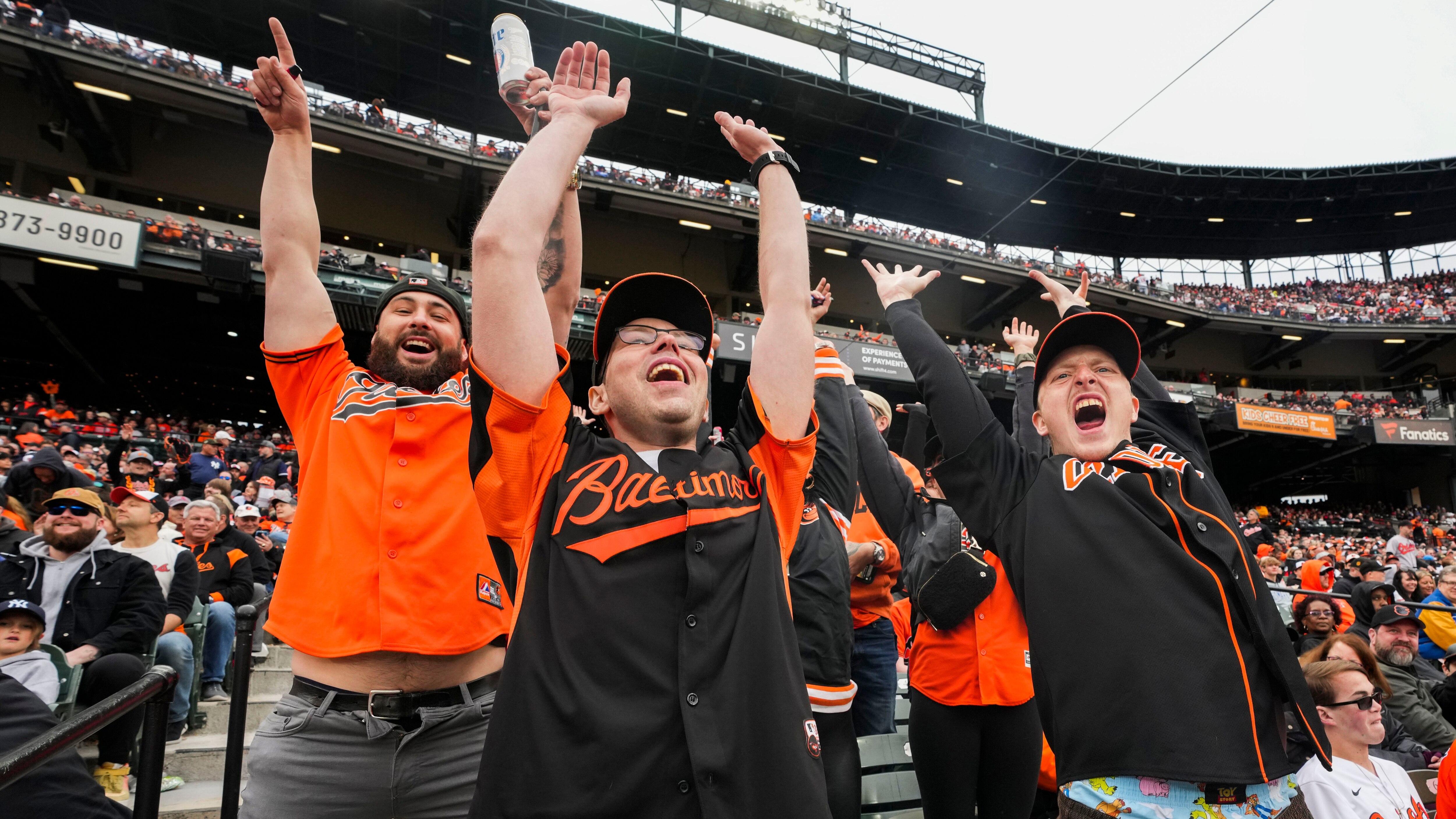 Matt Barnes, Stephen Vannoy, Joey Morgan attempt to start the "wave" at the Orioles home opener.