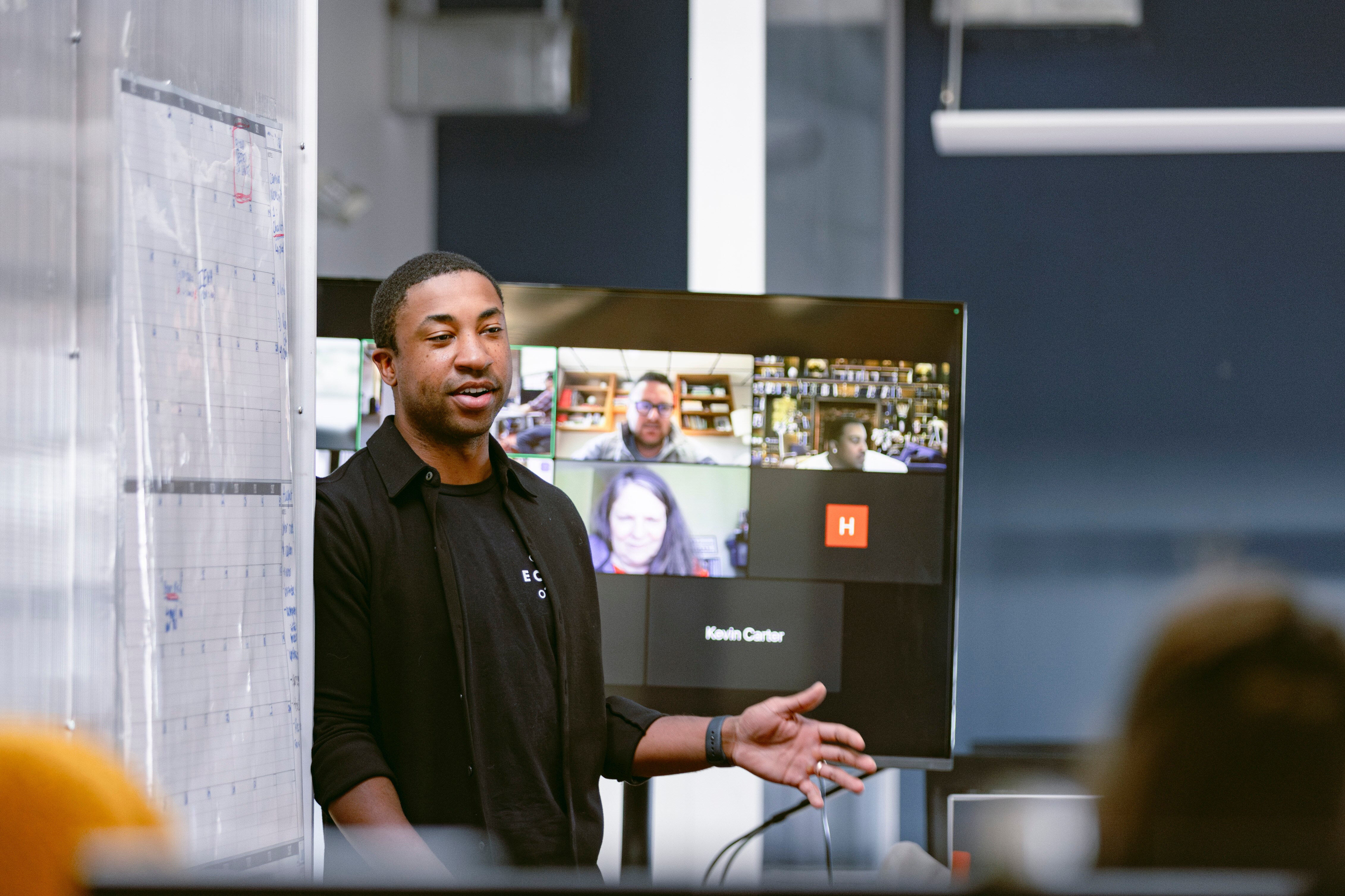 EcoMap co-founder and CEO Sherrod Davis leads a team meeting at at the EcoMap headquarters on Monday, Dec. 18, 2023 in Baltimore, Maryland. Davis was appointed as CEO in October, following the death of co-founder Pava LaPere. (Wesley Lapointe/for The Baltimore Banner)
