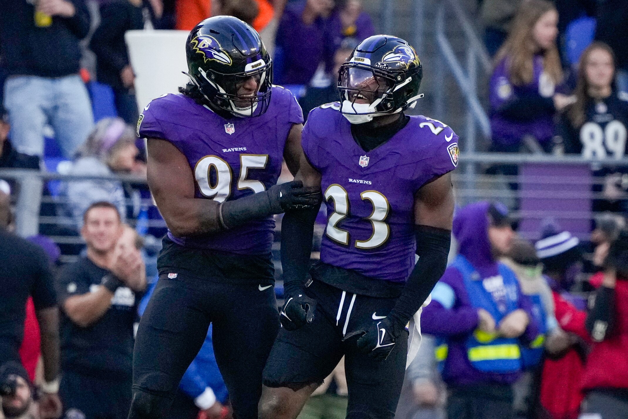 Baltimore Ravens linebacker Tavius Robinson (95) celebrates linebacker Trenton Simpson’s (23) sack of Denver Broncos quarterback Bo Nix in a regular season game at M&T Bank Stadium on Sunday, November 3, 2024.