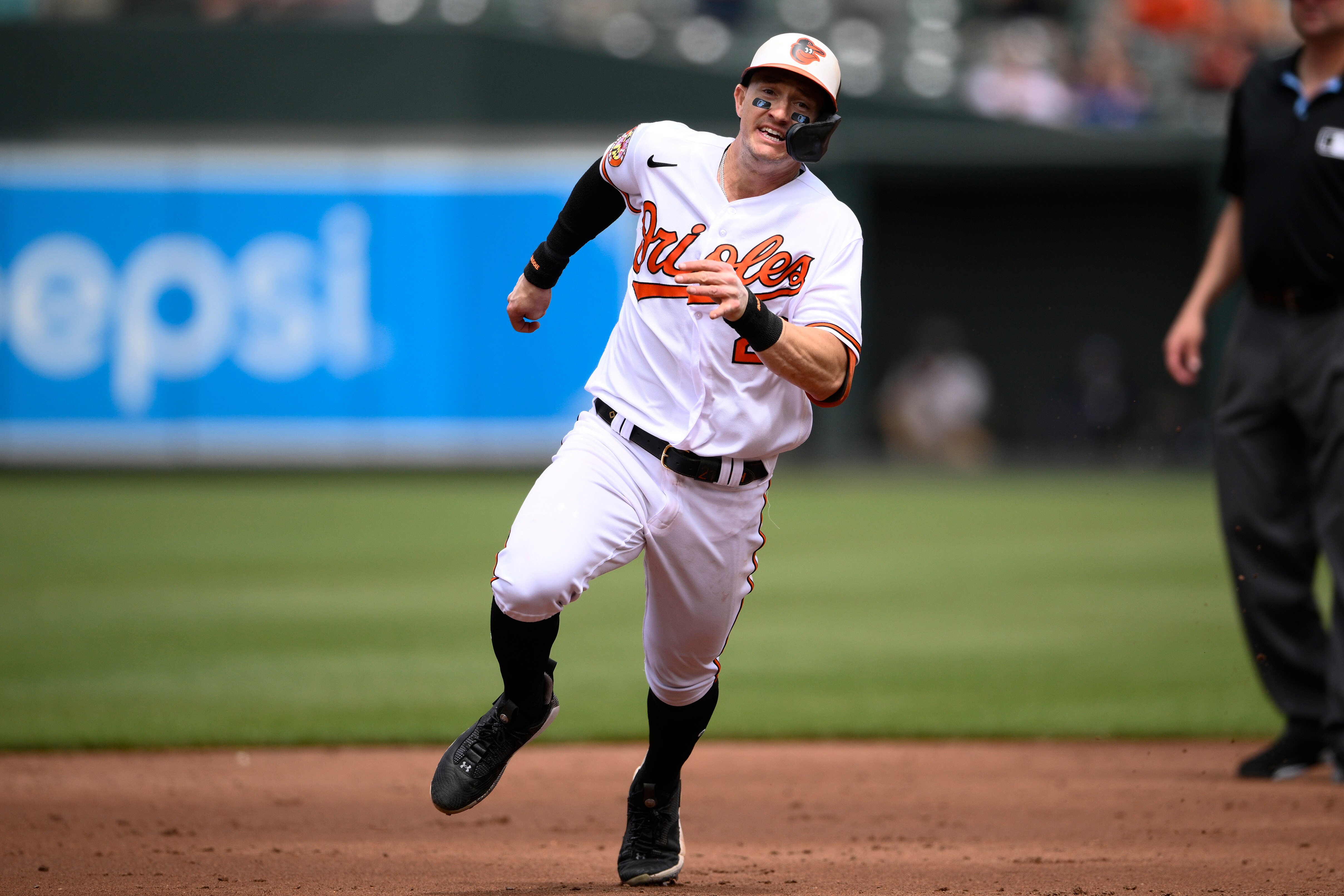 Baltimore Orioles' Austin Hays runs toward third for a triple during the third inning of a baseball game against the Texas Rangers, Sunday, May 28, 2023, in Baltimore.