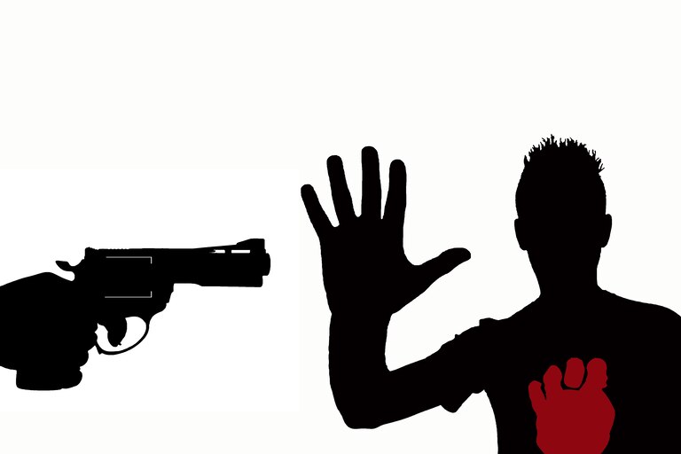silhouette of hand with gun pointed against guy with arm raised and open hand on a white background