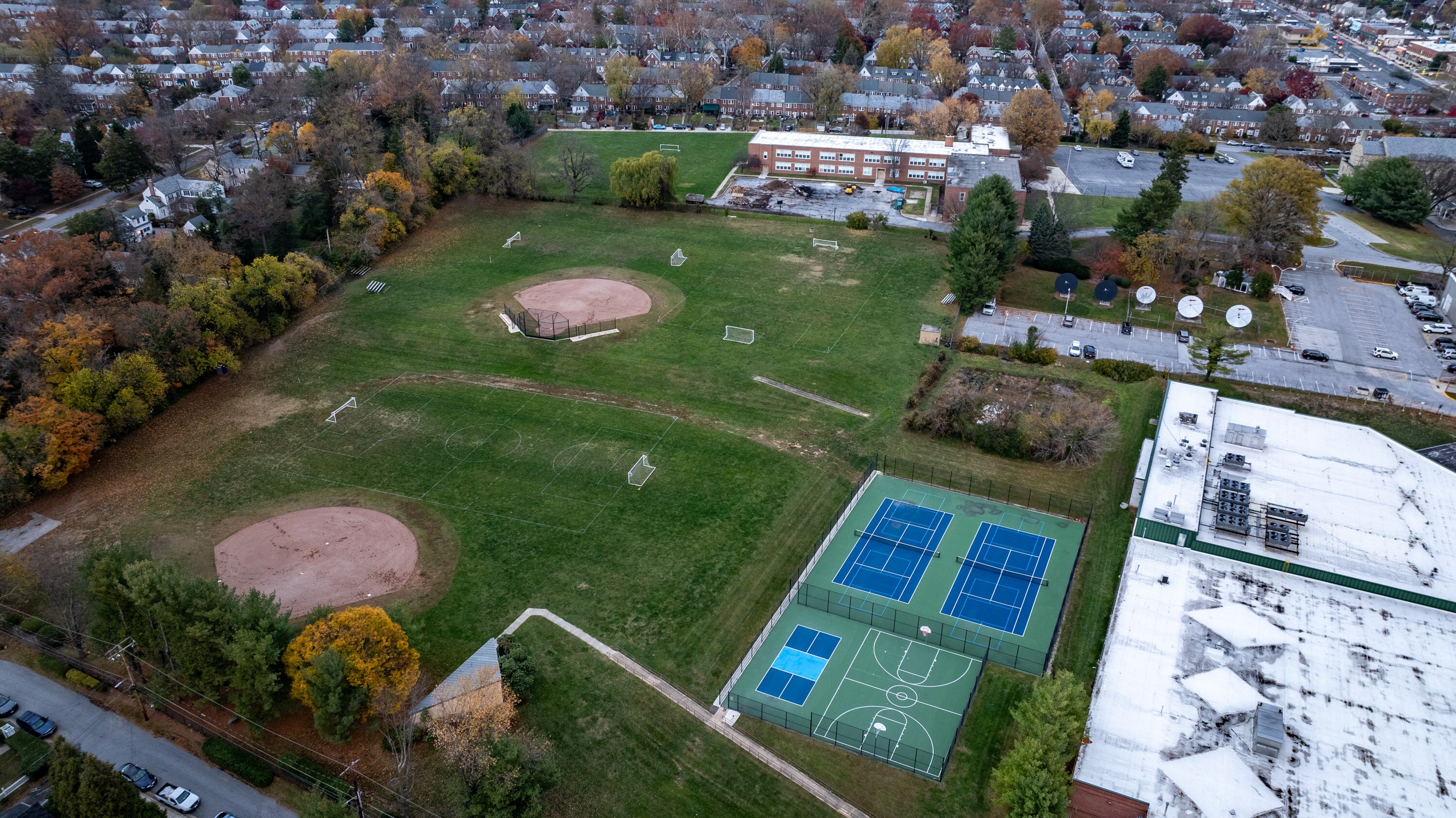 Ball fields are seen behind the St. Pius X School, top center, which closed in 2021 due to declining enrollment.