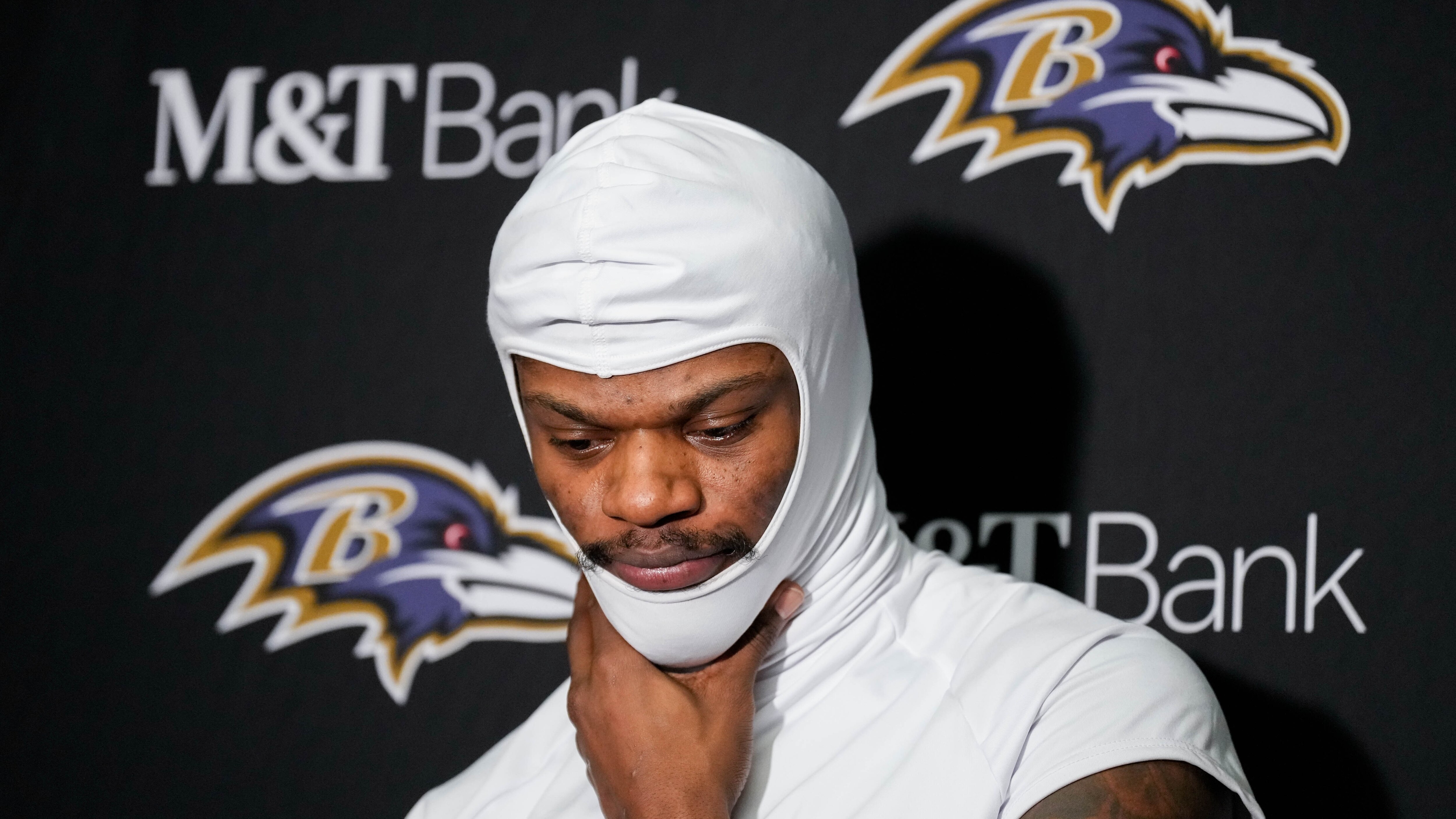 Baltimore Ravens quarterback Lamar Jackson (8) takes questions from reporters after losing to the Buffalo Bills in a divisional round playoff game at Highmark Stadium in Orchard Park, NY. on Sunday, January 19, 2025.
