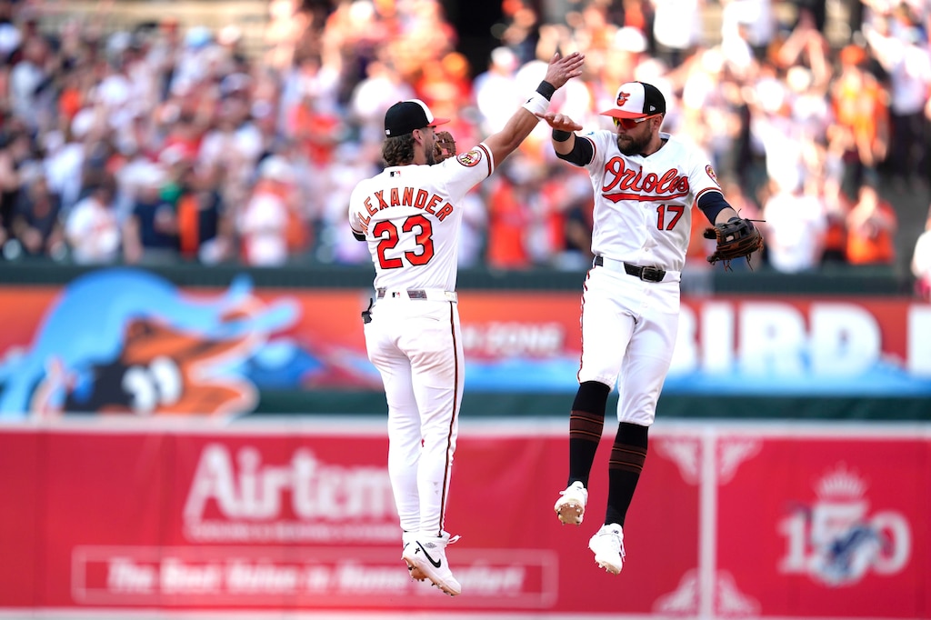 Second baseman Blaze Alexander leaps in the air to greet center fielder Colton Cowser after the end of an opening-day baseball game against the Minnesota Twins at Camden Yards in Baltimore. The Orioles beat the Minnesota Twins 2-1.