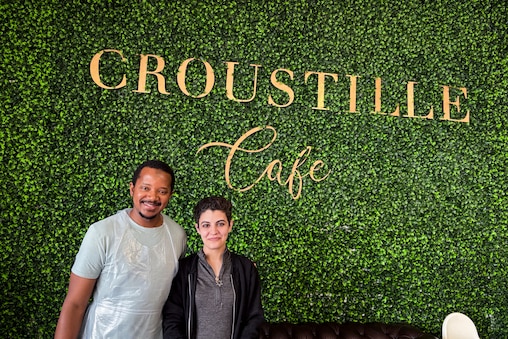 Mamadou Diallo bakes the breads at Croustille Café and Talya Fishman works behind the counter. Their café is warm and inviting.