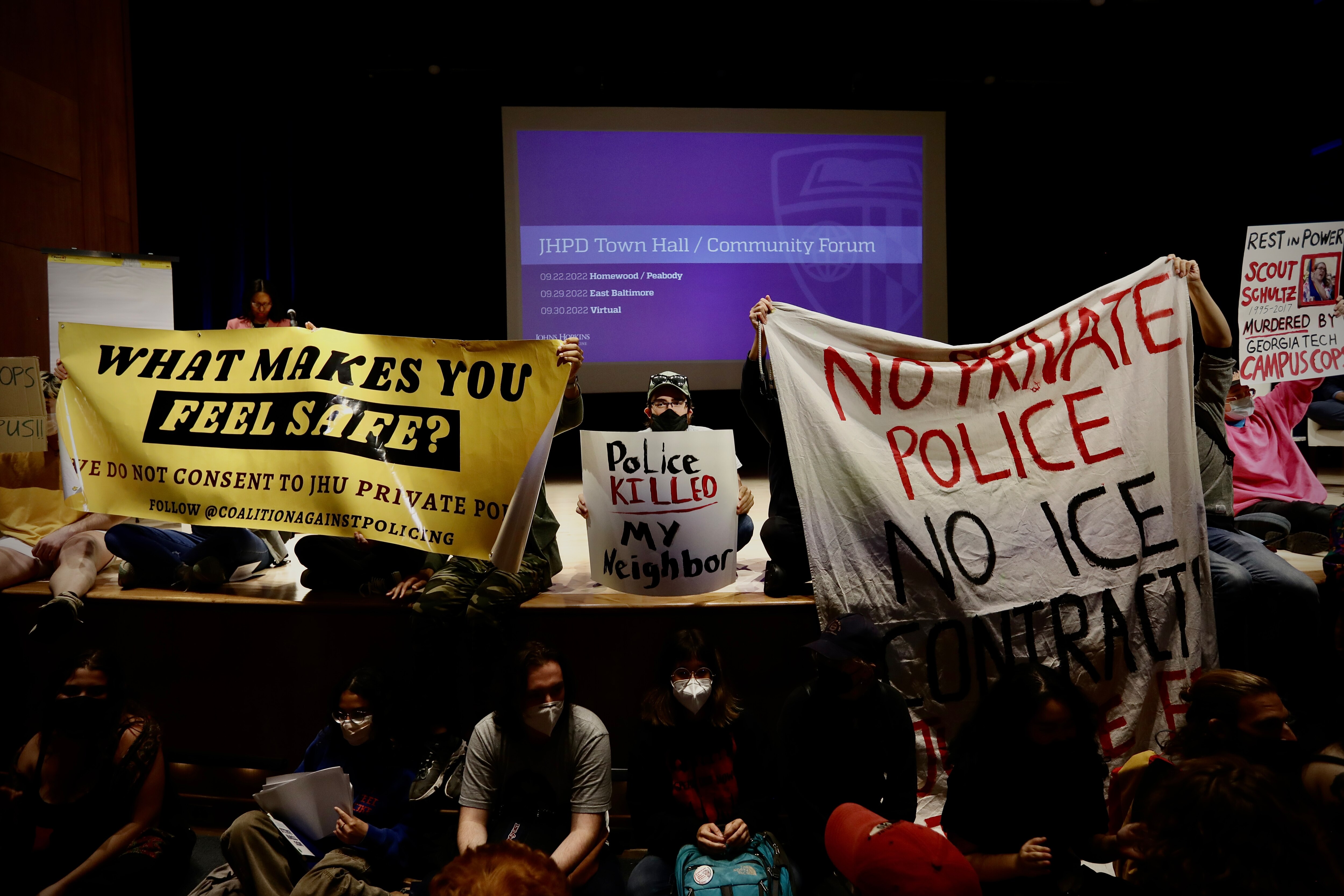 A large group of student protesters who oppose plans to create an armed, private Johns Hopkins University police force disrupted a public meeting scheduled for Thursday evening.