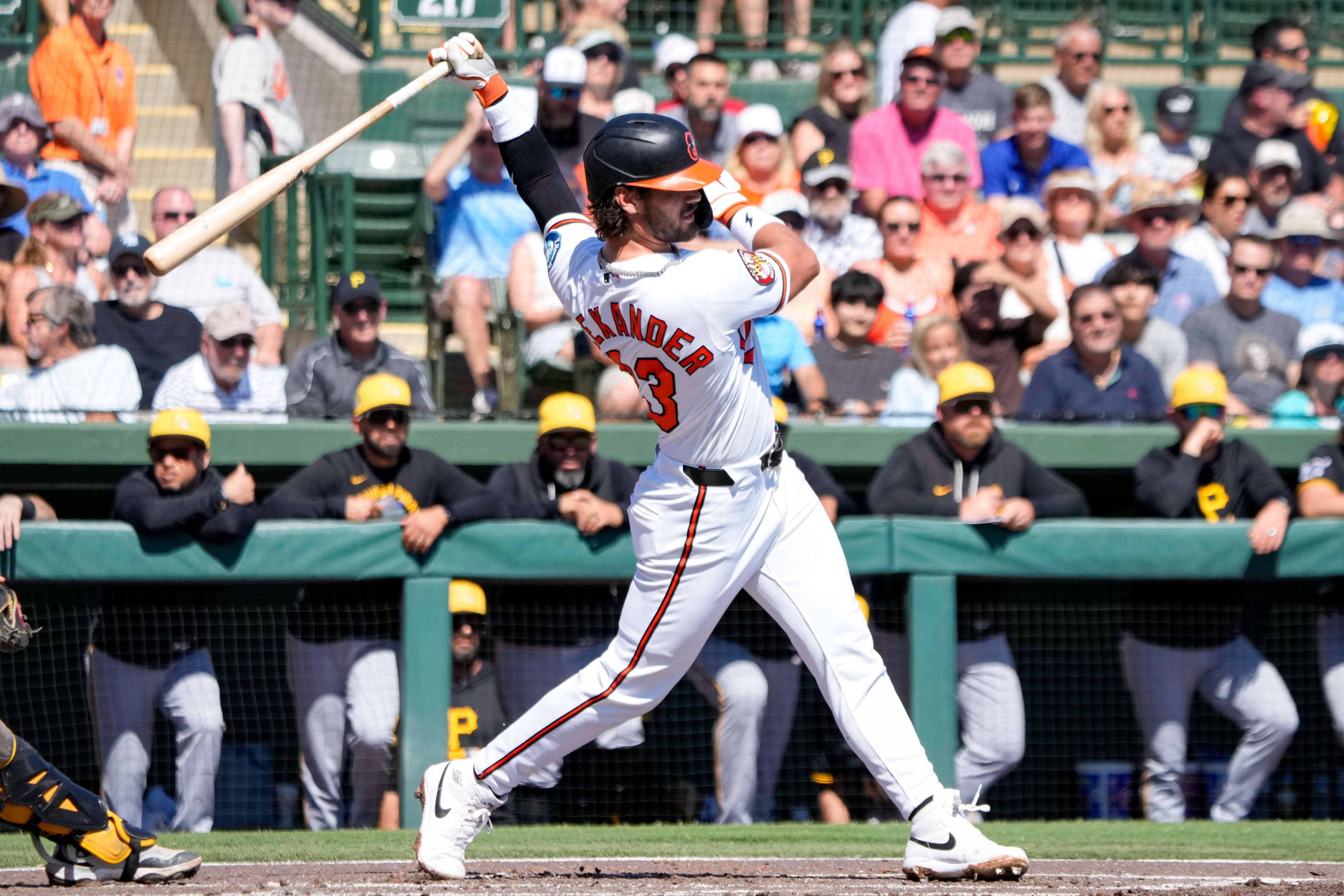 Orioles infielder Blaze Alexander swings at a pitch in a spring training game against the Pirates.
