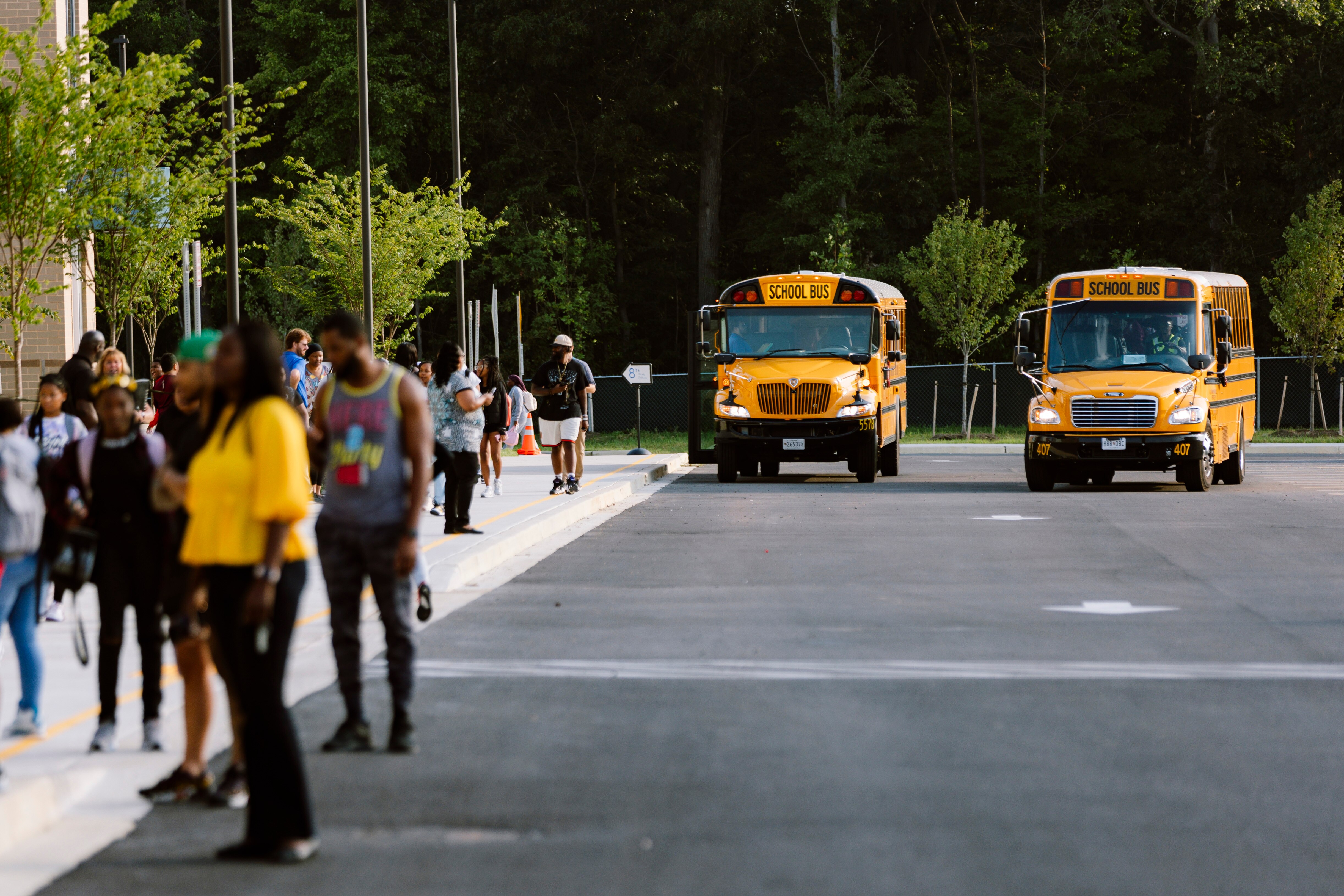 Two school buses arrive to Nottingham Middle School before the first day of school.