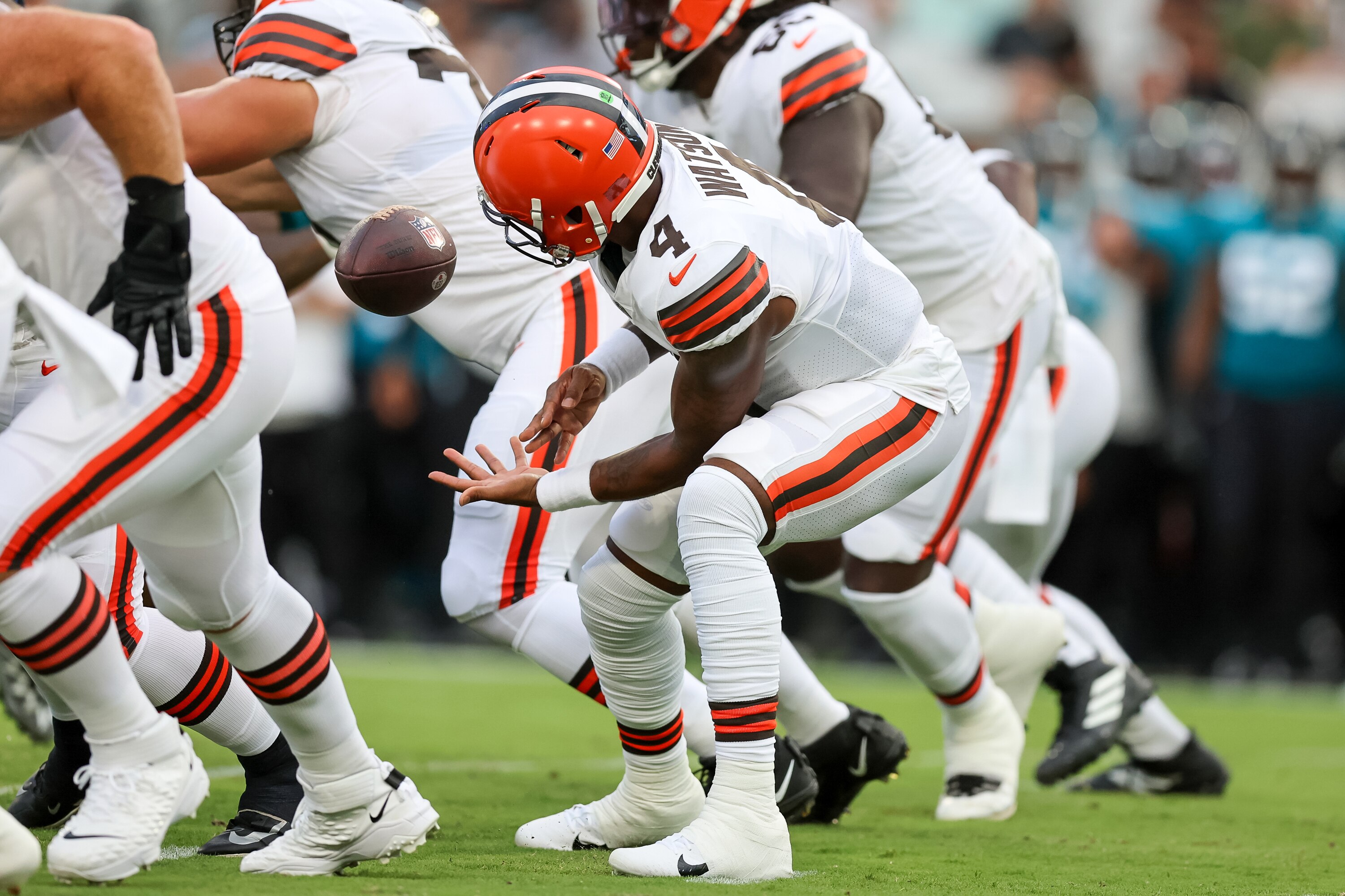 JACKSONVILLE, FL - AUGUST 12: Deshaun Watson #4 of the Cleveland Browns fumbles a snap against the Jacksonville Jaguars during a football game at TIAA Bank Field on August 12, 2022 in Jacksonville, Florida. (Photo by Mike Carlson/Getty Images)