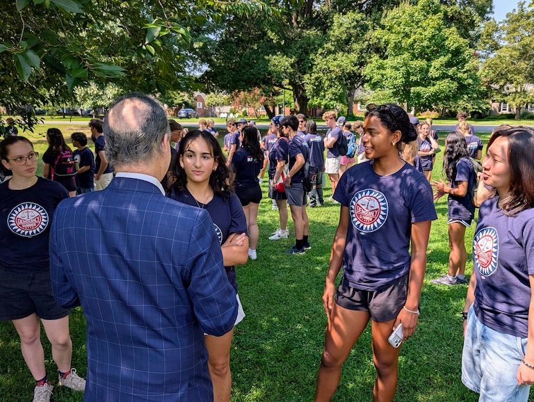 Naomi Tirat-Gefen, center, talks to U.S. Rep. Jamie Raskin during a Democracy Summer about a voter canvass in Easton. Tirat-Gefen, Claire Yonly and Ella Sohn were among 80 teenagers in the program who turned out on July 26, 2026