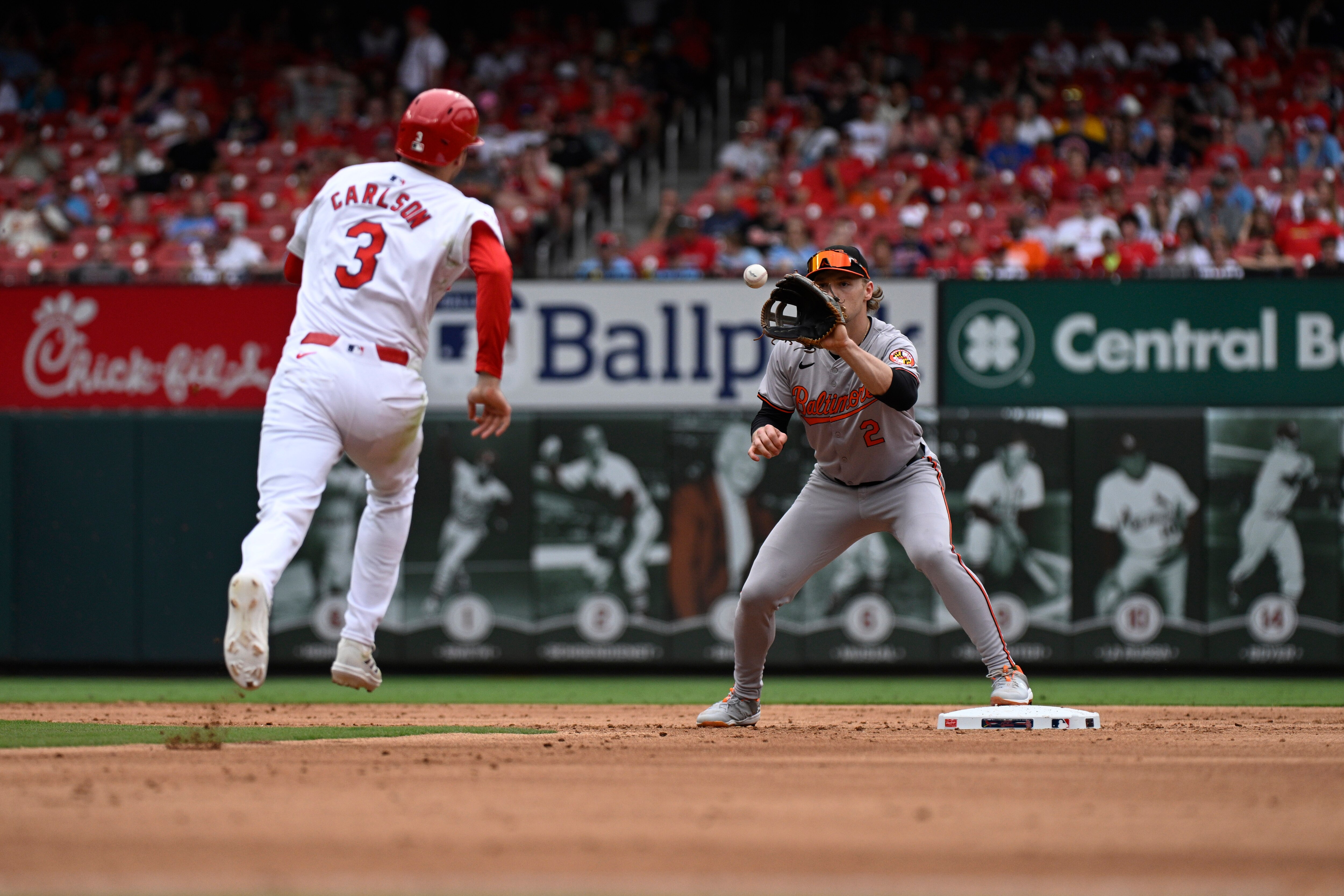 Orioles shortstop Gunnar Henderson forces out Dylan Carlson of the Cardinals during the second inning.