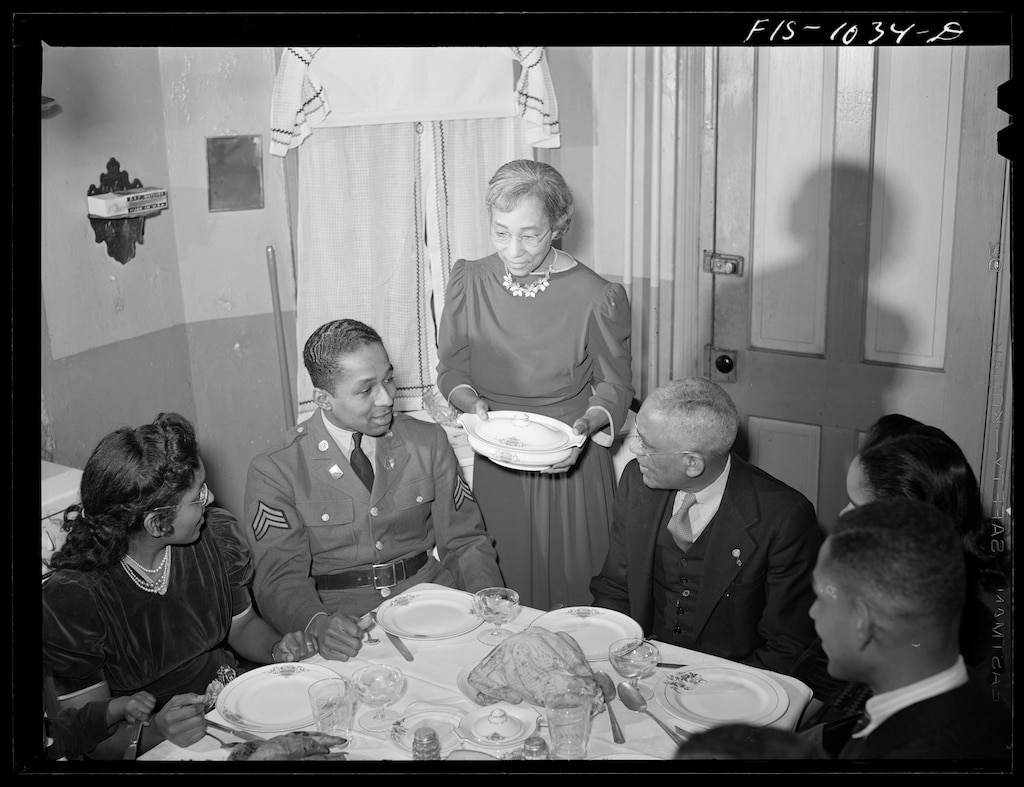 Baltimore, Maryland. Sargeant Franklin Williams, home on leave from Army duty, with his father and mother.