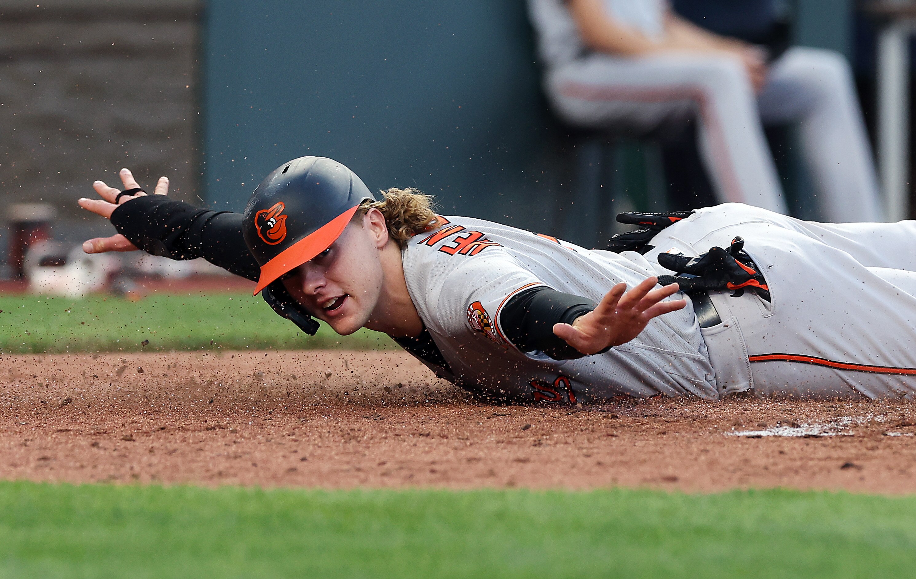 Gunnar Henderson #2 of the Baltimore Orioles slides safely past catcher Salvador Perez #13 of the Kansas City Royals to score on a line drive by Cedric Mullins #31 during the 4th inning of the game at Kauffman Stadium on May 02, 2023 in Kansas City, Missouri.