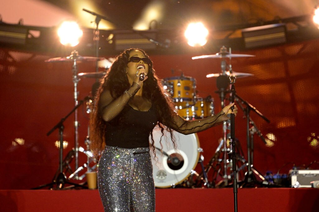 H.E.R., seen performing in Paris on June 22, 2023, is set to headline this year’s Charm City Live festival.