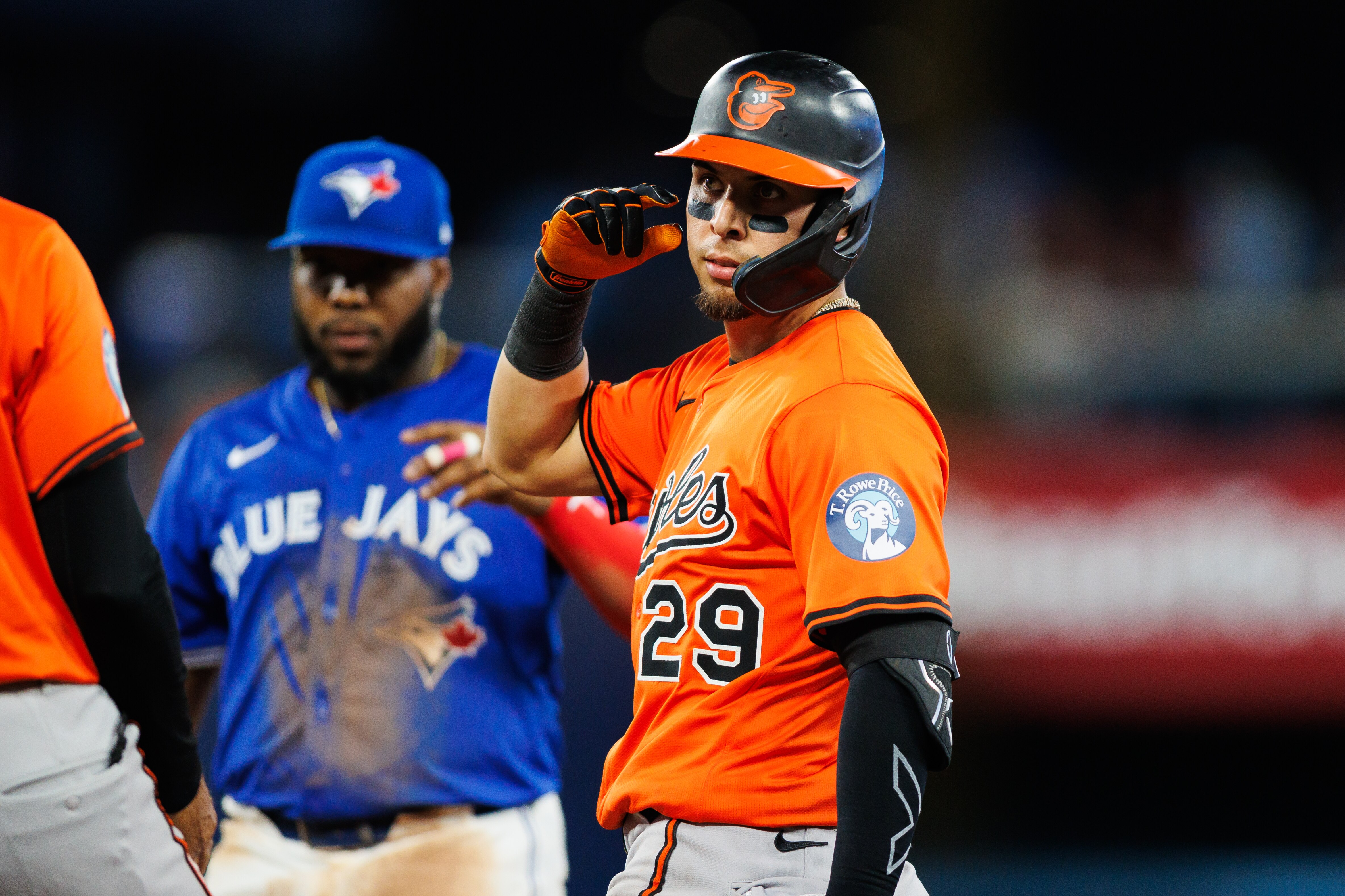 Ramón Urías signals to the dugout after his three-run double in the fourth inning of the Orioles’ 9-5 win at Toronto on Saturday.