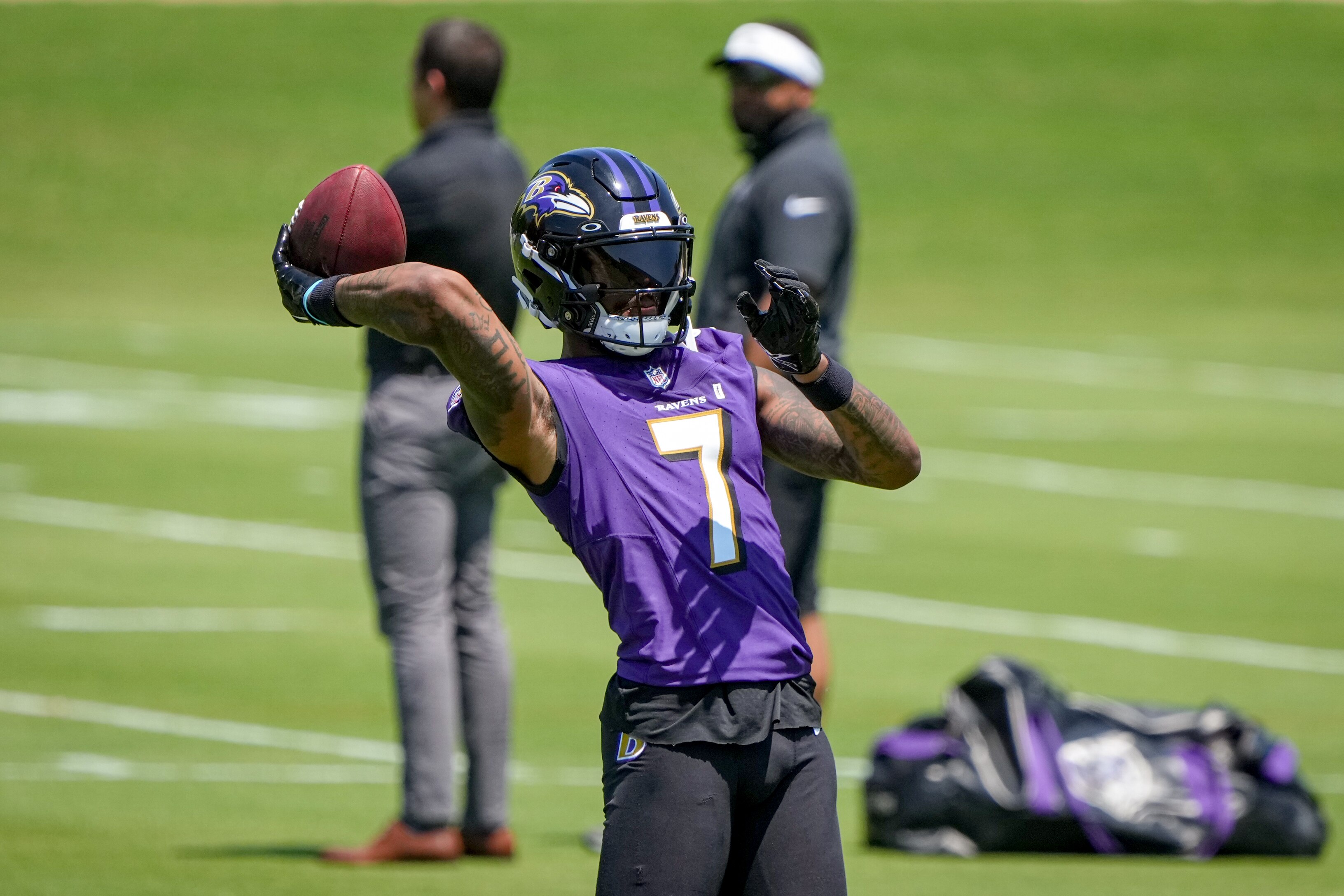 Baltimore Ravens receiver Rashod Bateman throws a football during practice at the Under Armour Performance Center in Owings Mills on May 22, 2024.