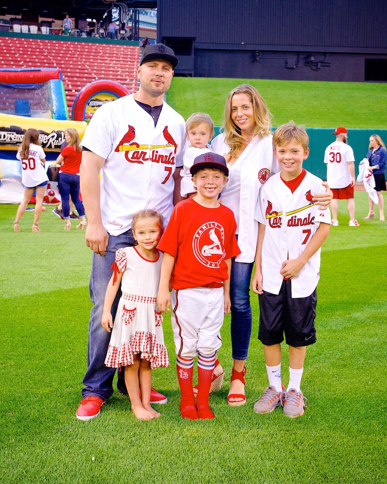 The Holliday family, featuring former All-Star Matt and a young Jackson Holliday, pose at Busch Stadium in St. Louis.