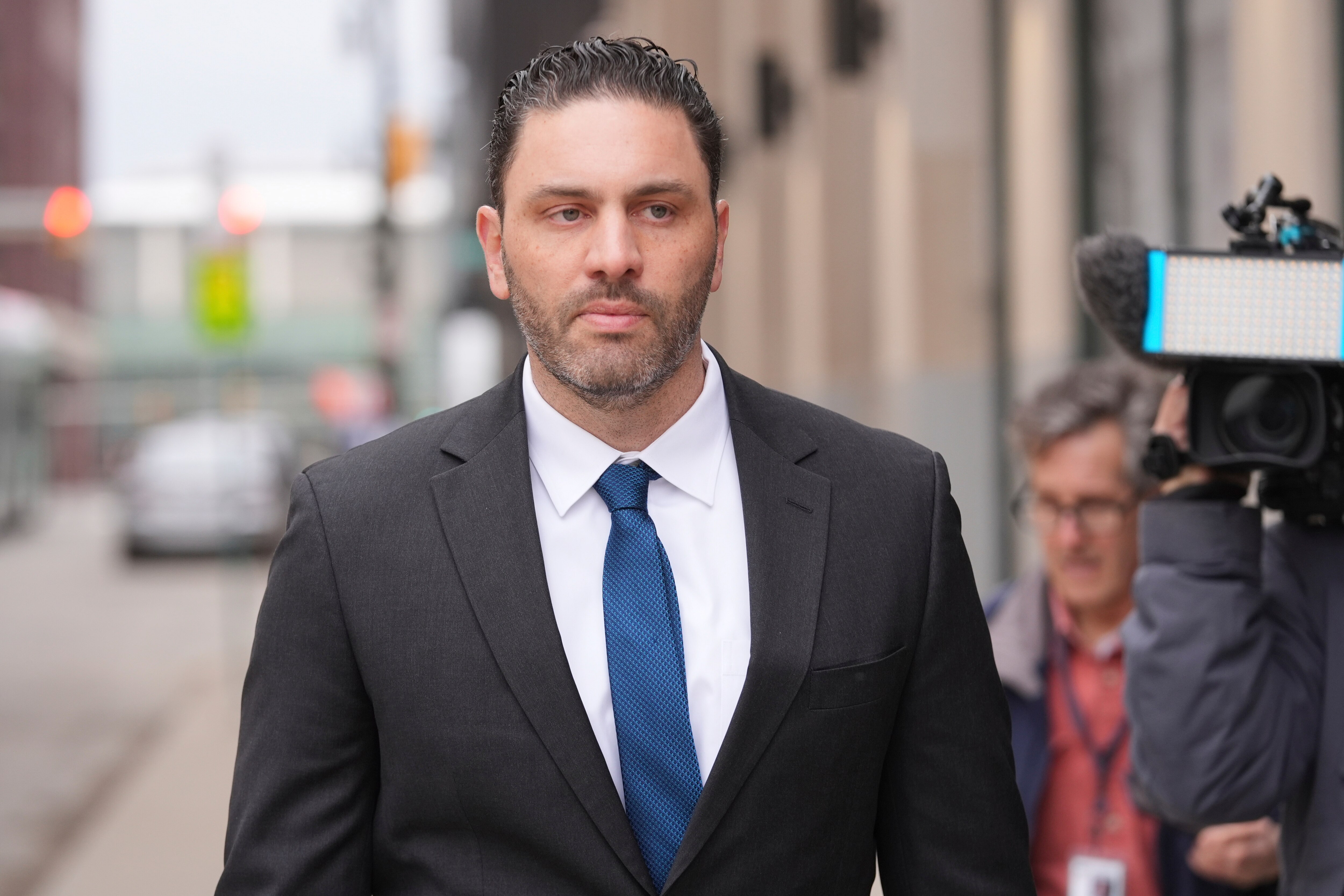 Former Ravens and University of Michigan assistant football coach Matt Weiss leaves federal court in Detroit, Monday, March 24, 2025. (AP Photo/Paul Sancya)