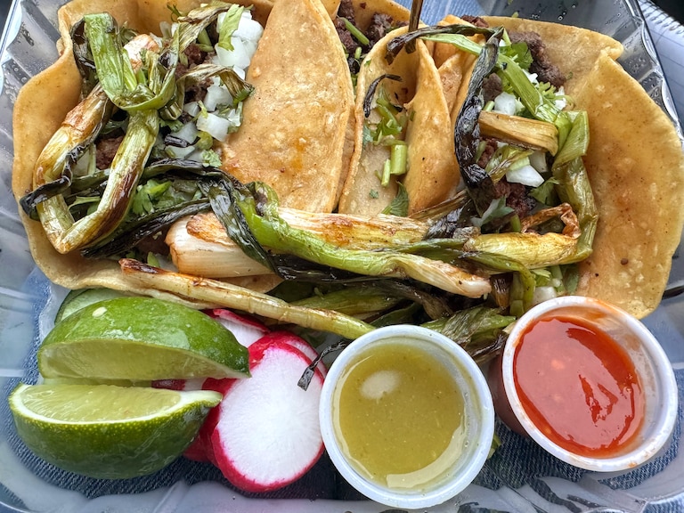 Al Pastor tacos from the Tacos El Guero Food Truck off Merritt Boulevard come with actual notes of pineapple, the classic savory grilled scallions and remarkably spiced sauces.
