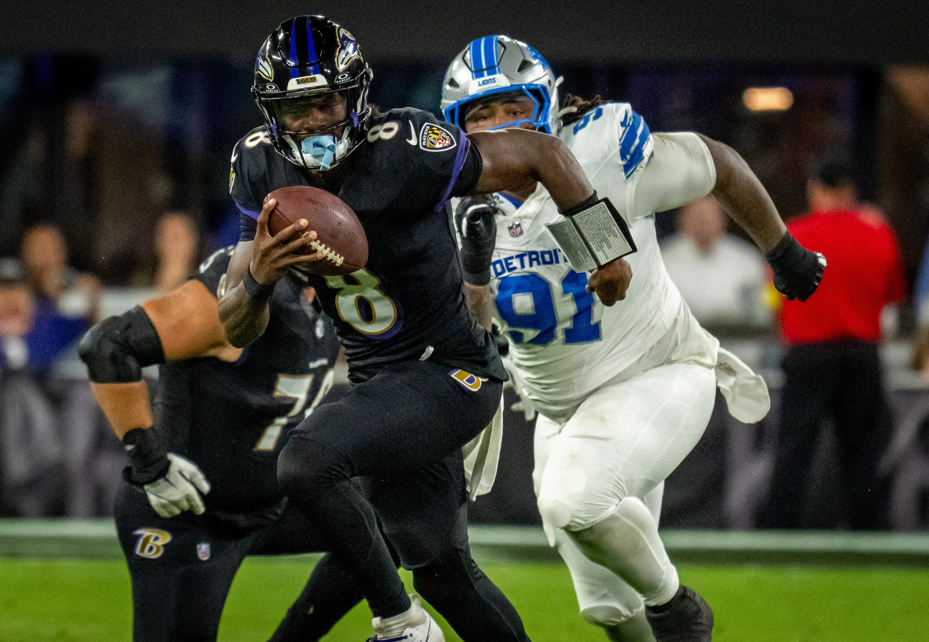 Baltimore Ravens quarterback Lamar Jackson runs wide for a 13-yard gain against the Detroit Lions in September.
