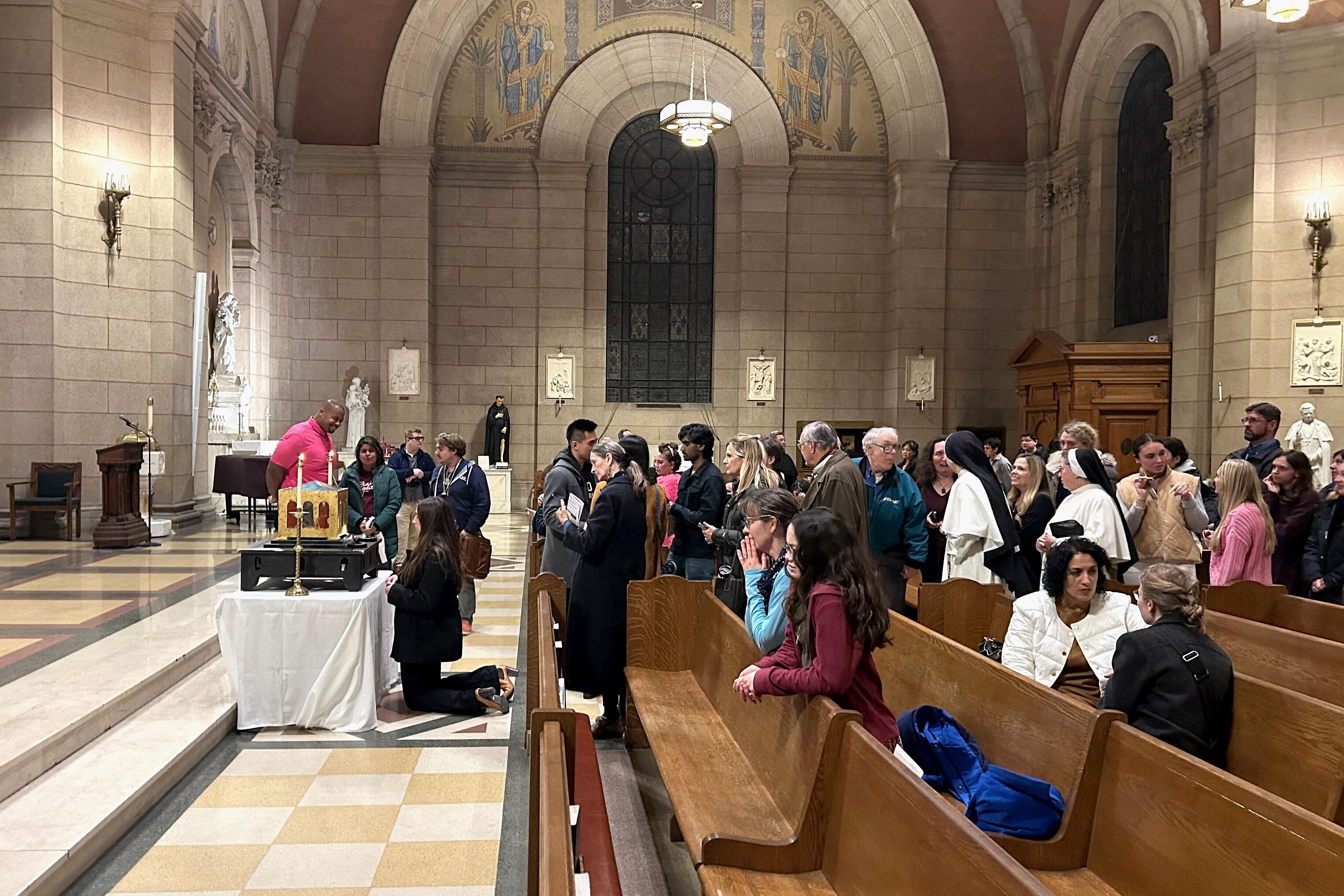 Hundreds gathered at Sts. Philip and James Church on North Charles Street for the final chance to see the relics of St. Thomas Aquinas for the last time in the U.S.