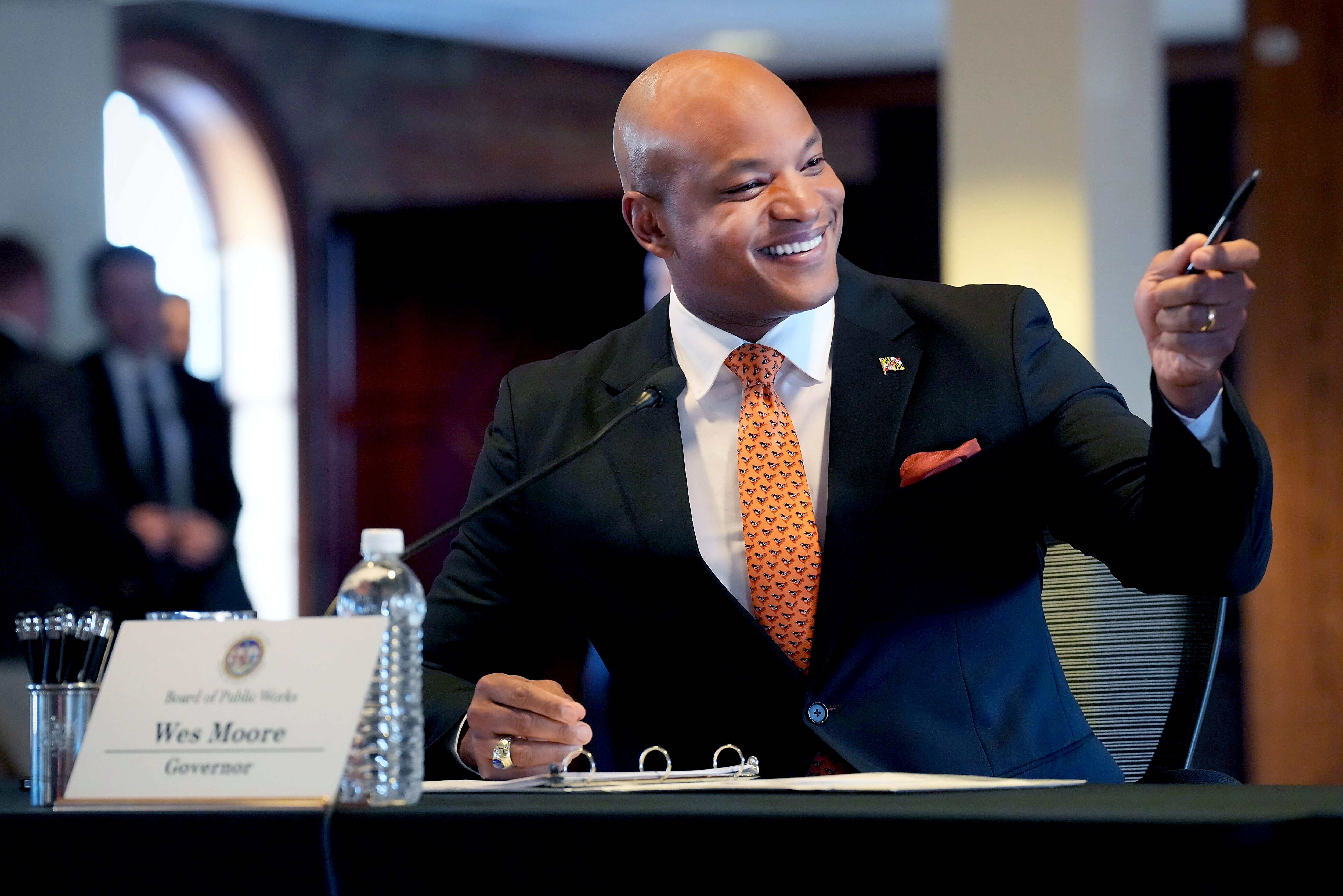 Gov. Wes Moore delivers remarks at a special meeting of the Board of Public Works inside the Camden Yard warehouse after the Maryland Stadium Authority voted to extend the Orioles lease at the ballpark on Monday, Dec. 18, 2023.