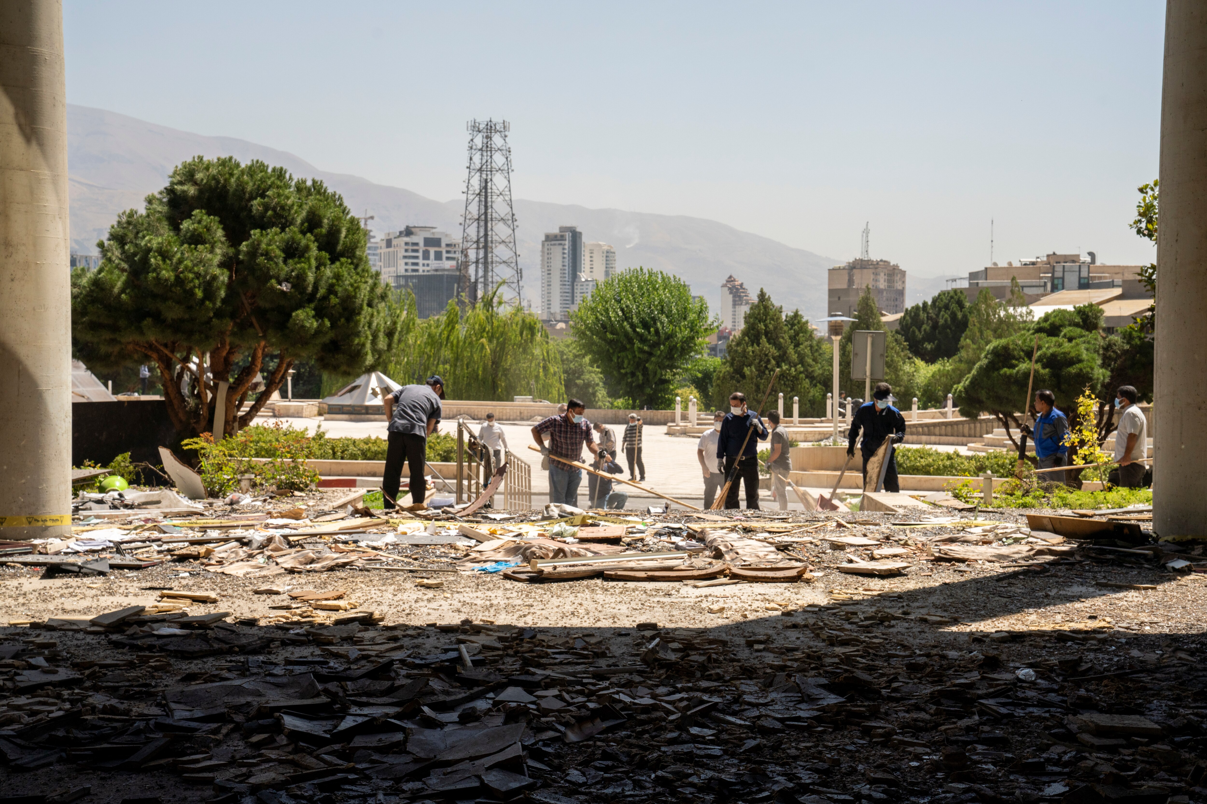 TEHRAN, IRAN - JUNE 19: Cleanup efforts are underway at a damaged building used by the Iranian Broadcasting Organisation, hit by Israeli missiles days earlier on June 16, during a press tour on June 19, 2025 in Tehran, Iran. Over recent days, Iran has been hit by a series of Israeli airstrikes targeting military and nuclear sites, as well as top military officials, prompting Iran to launch a counterattack.
