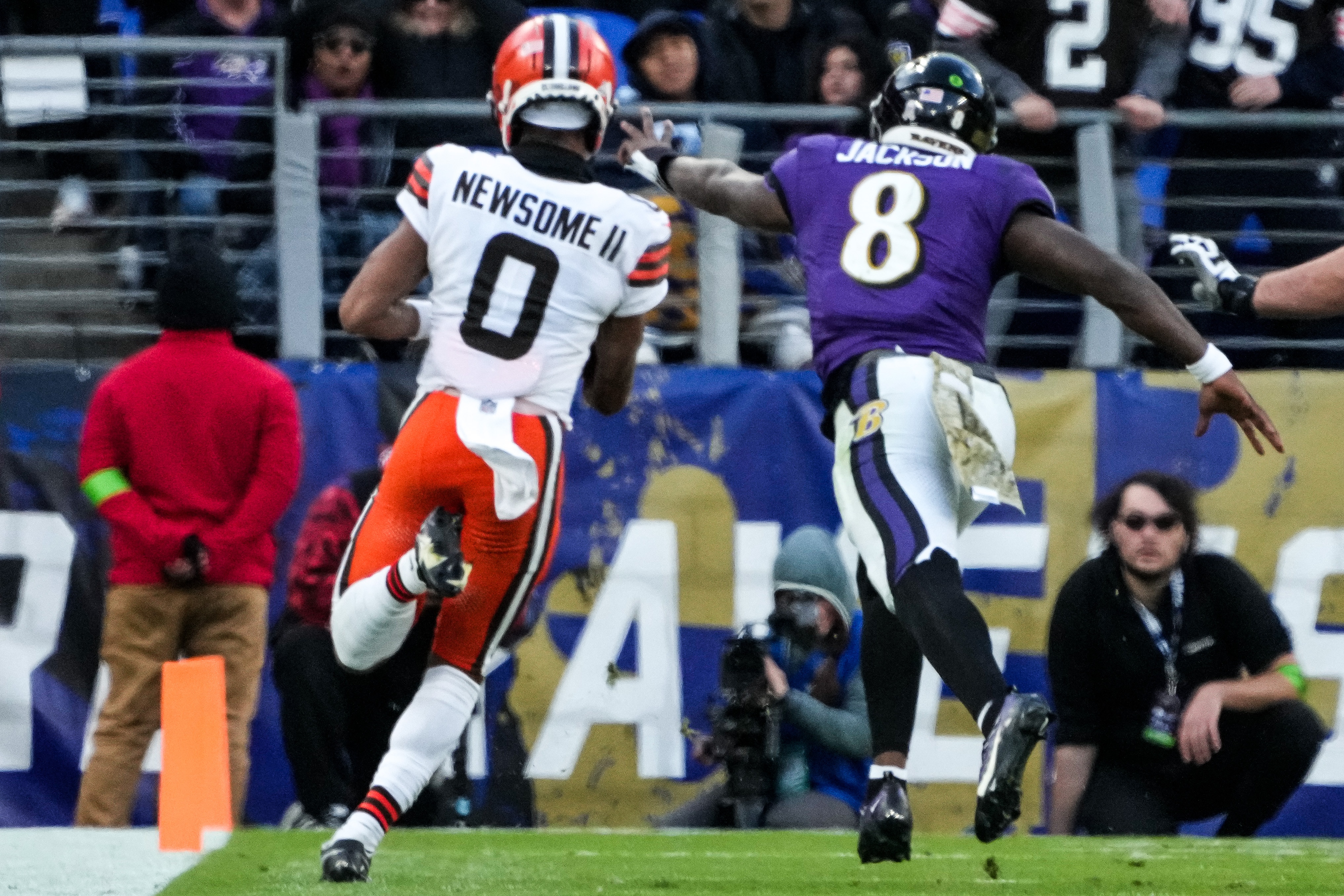 Browns cornerback Greg Newsome II eludes Ravens quarterback Lamar Jackson to score on a 34-yard interception return during the fourth quarter of Cleveland's 33-31 win Sunday.