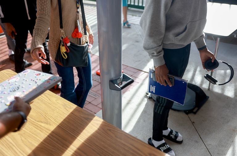 Summer school students walk through a newly installed CEIA OpenGate weapons detection system at Charles W. Flanagan High School on June 24, 2024 in Pembroke Pines, Florida.