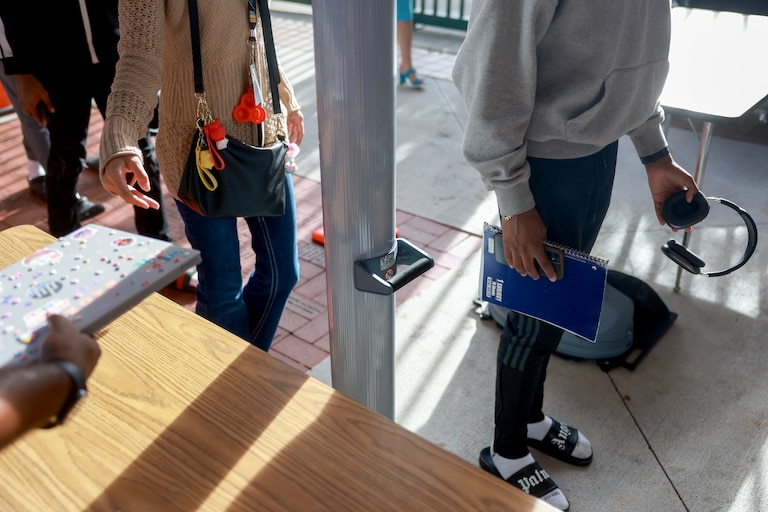 Summer school students walk through a newly installed CEIA OpenGate weapons detection system at Charles W. Flanagan High School on June 24, 2024 in Pembroke Pines, Florida.