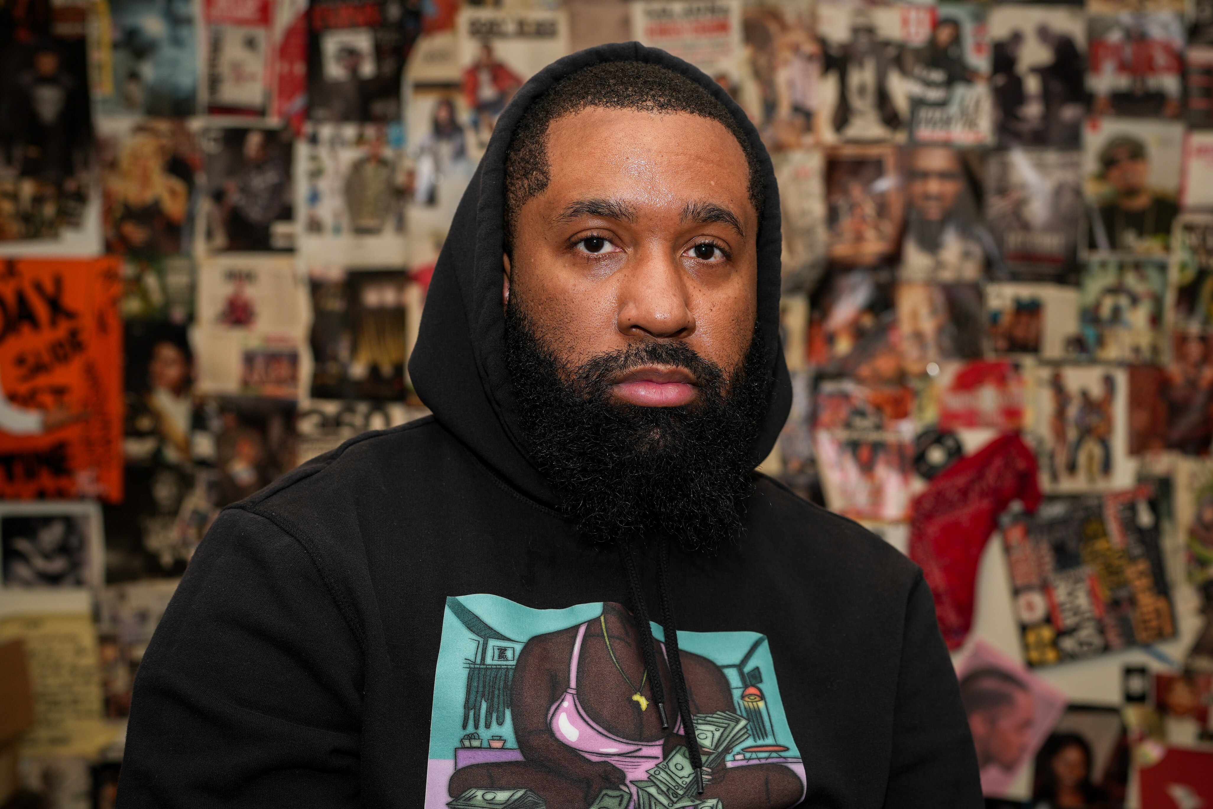 Milly Vanderwood in front of one of the walls at the In My Lifetime: Mini Hop-Hop Museum.