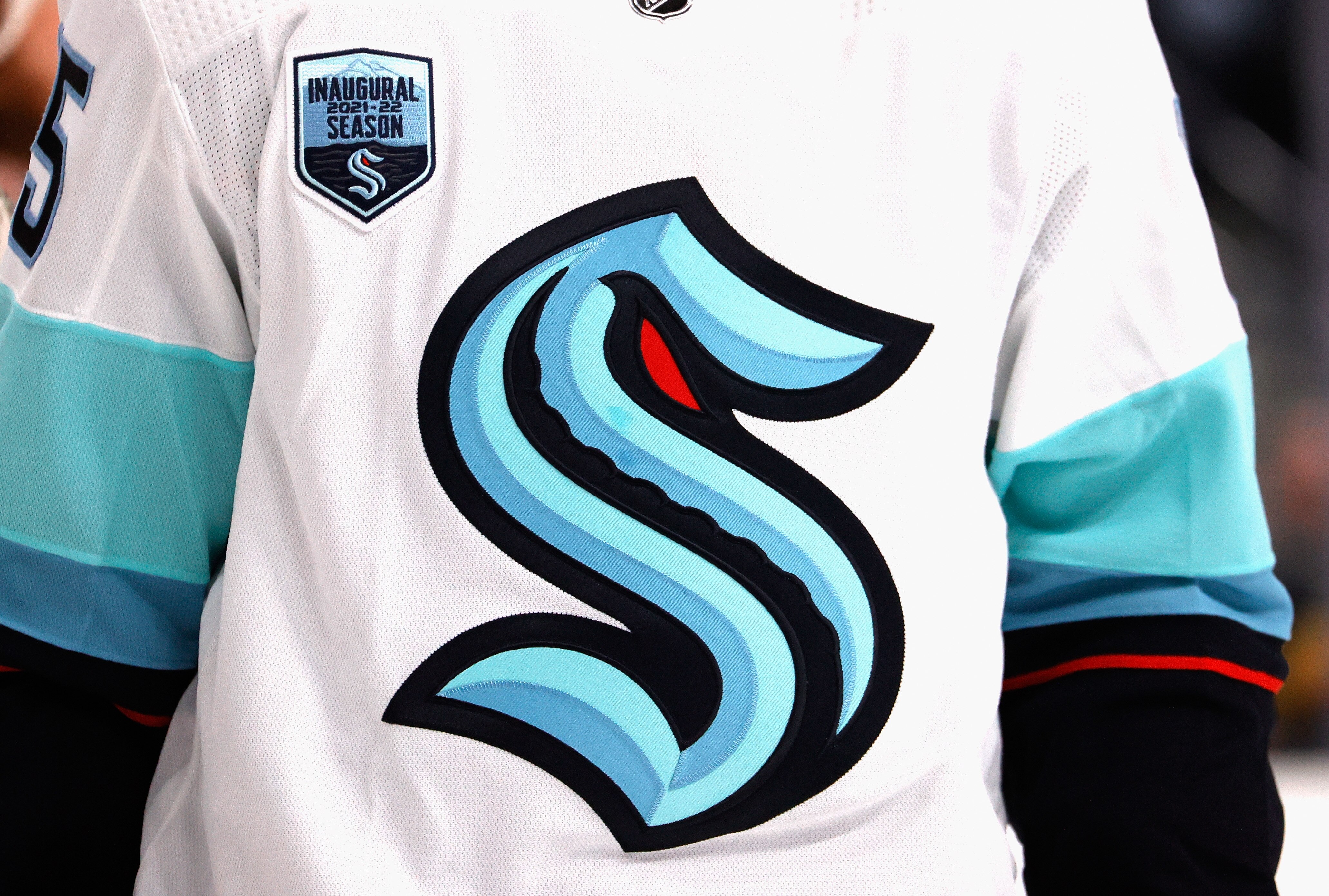 A close-up view shows the jersey of Riley Sheahan #15 of the Seattle Kraken as he waits for a faceoff during the second period against the Vegas Golden Knights during the Kraken's inaugural regular-season game at T-Mobile Arena on October 12, 2021 in Las Vegas, Nevada.